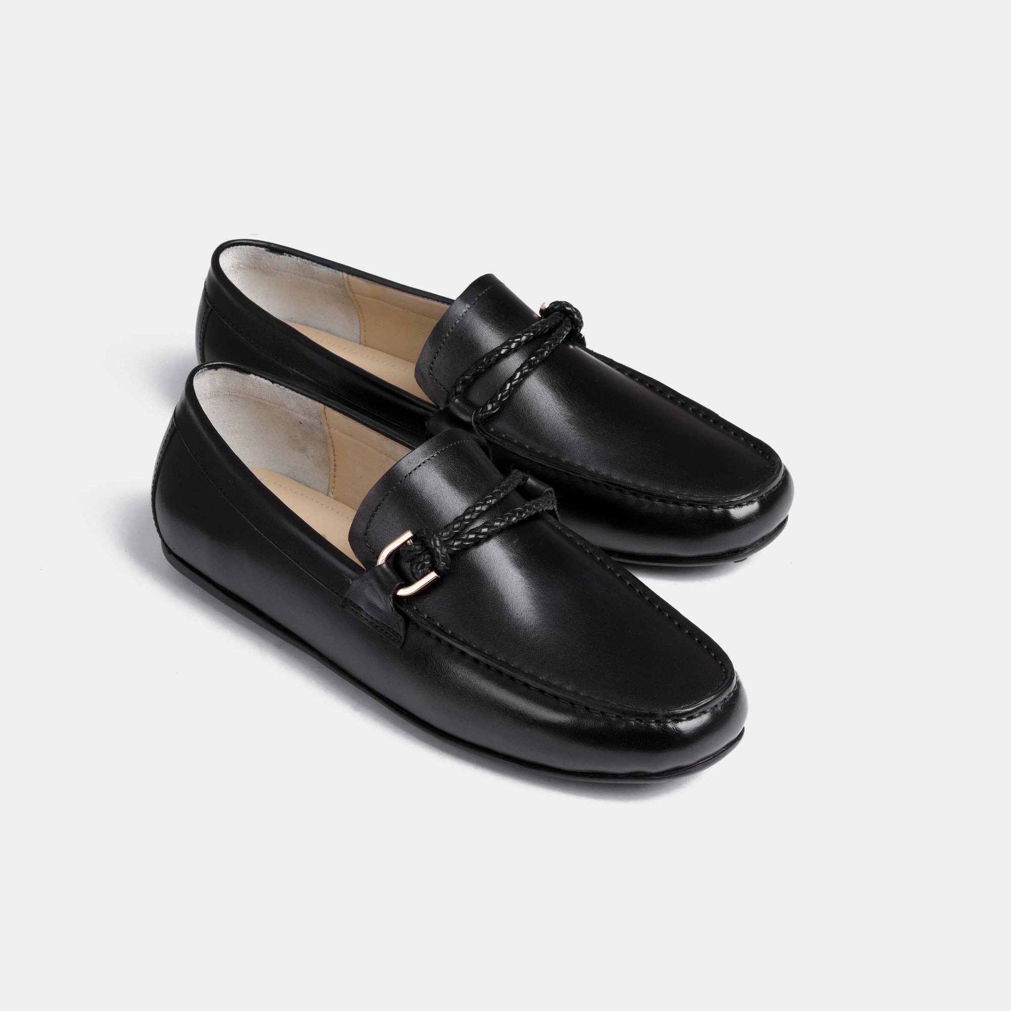 Pair of Pablo Black Leather Driving Loafers with a braided strap and metal accent.