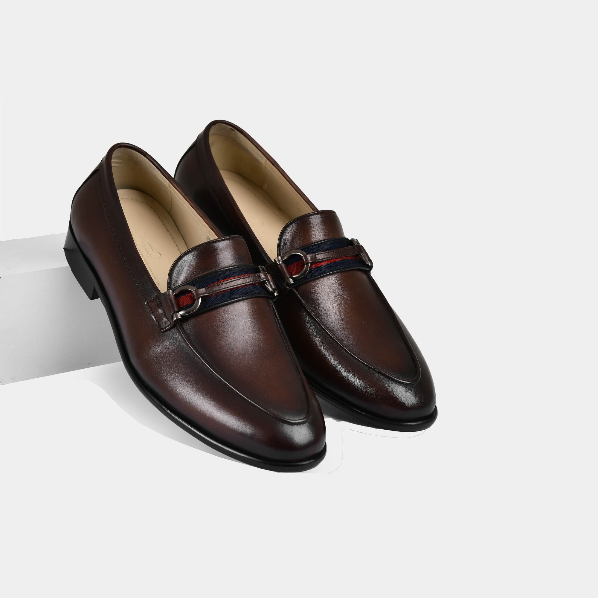 Pair of Armante Brown Leather Loafers with a red, white, and blue strap detail across the vamp.