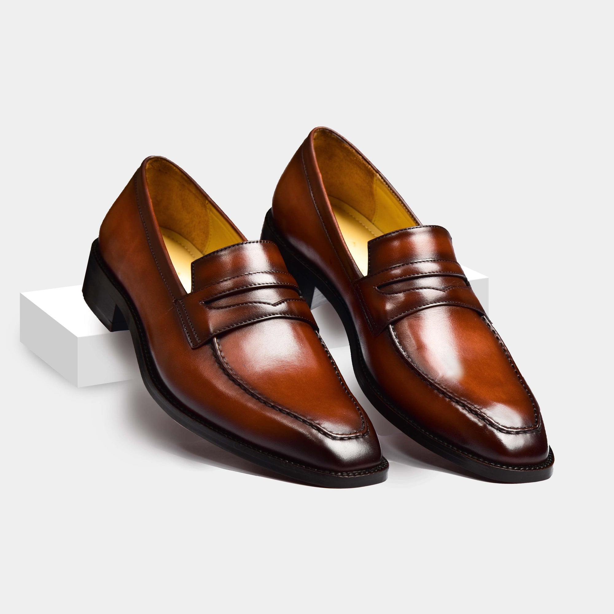 A pair of James Brown Leather Loafers in brown, showcasing their sleek design and polished finish.