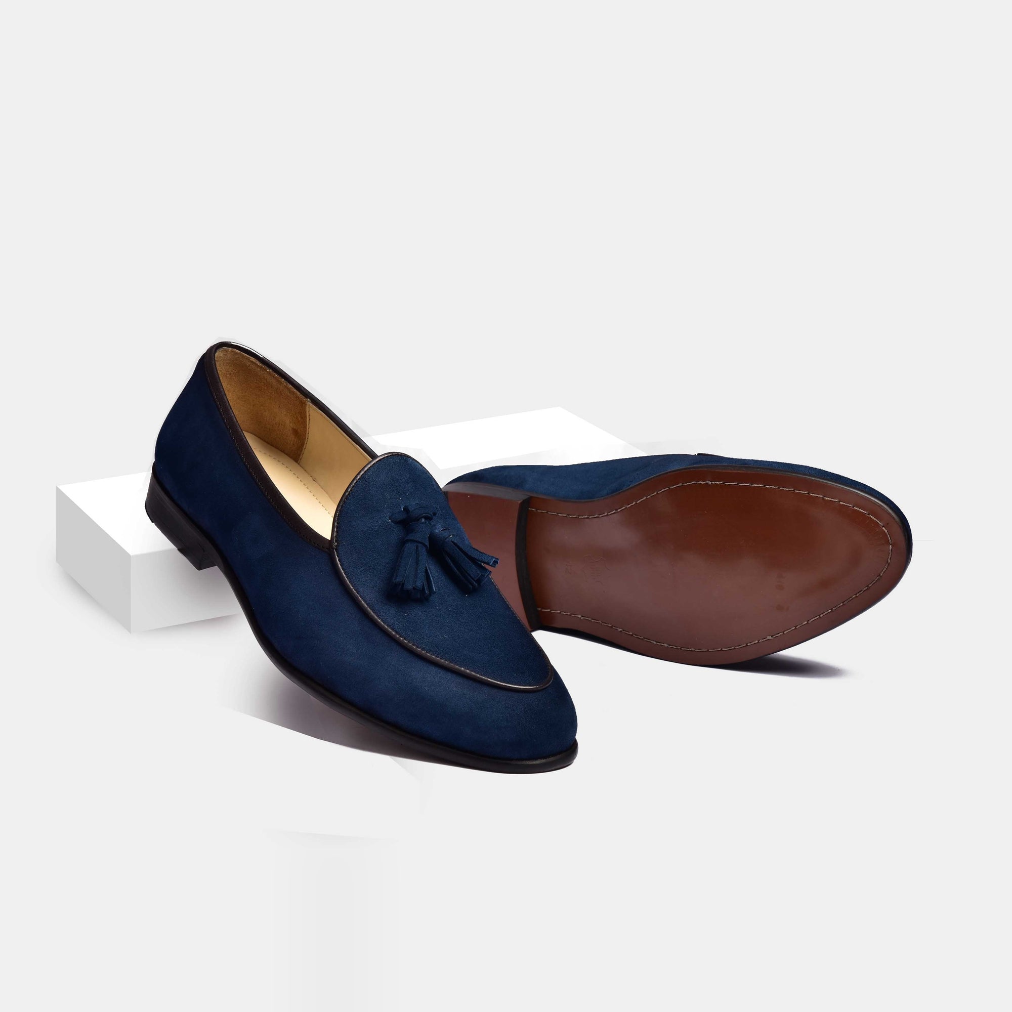 Pair of blue suede Arno loafers with classic tassels.