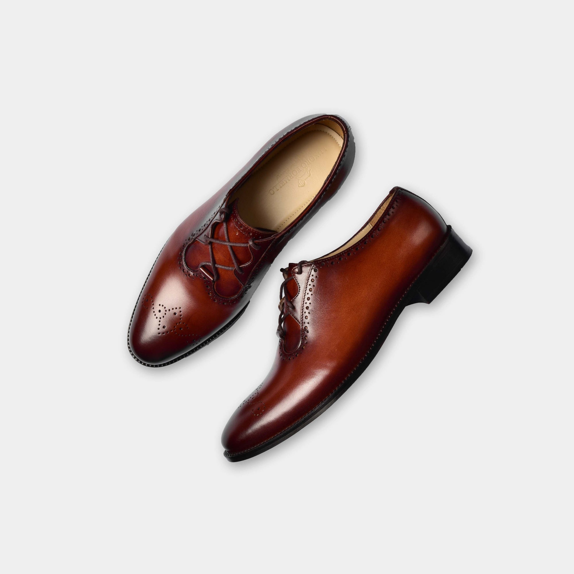 A pair of Alessandro Barone two-toned brown men's blucher shoes, featuring hand-stitching and broguing details.