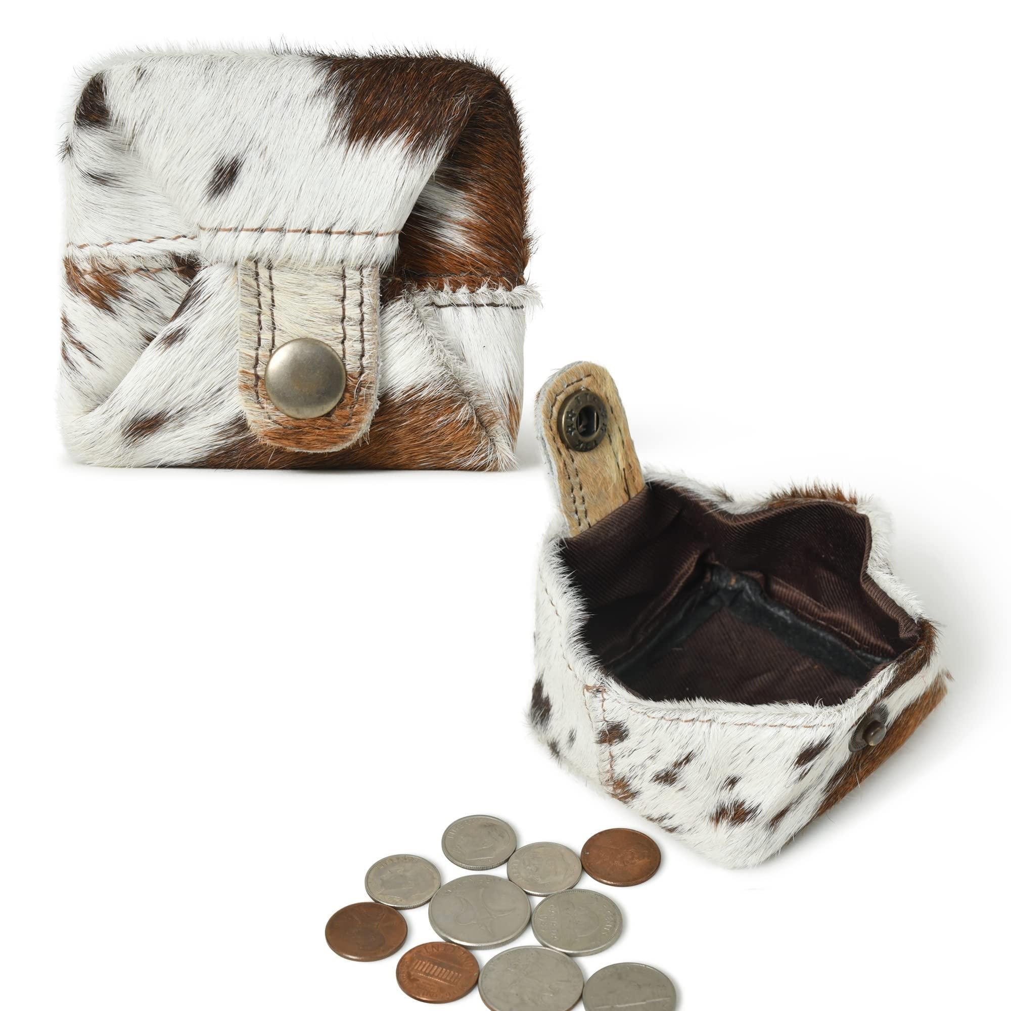 Stylish brown and white cowhide leather coin pouch with snap closure, shown open with coins beside it.