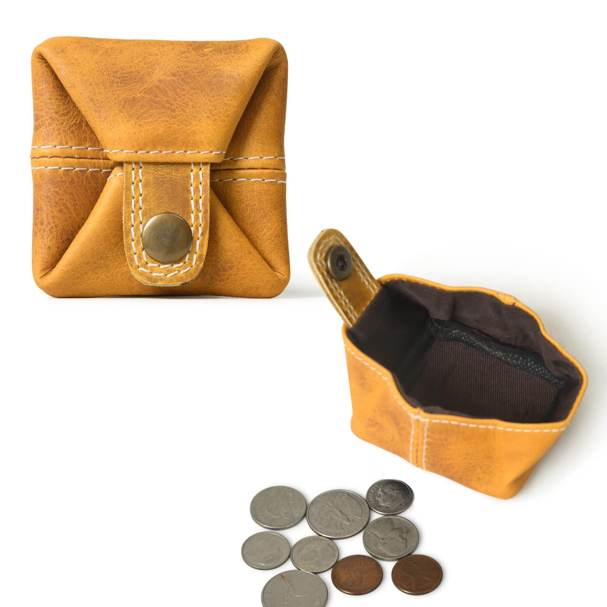 Mustard yellow mini pocket wallet made from full grain leather shown open and closed with coins beside it.