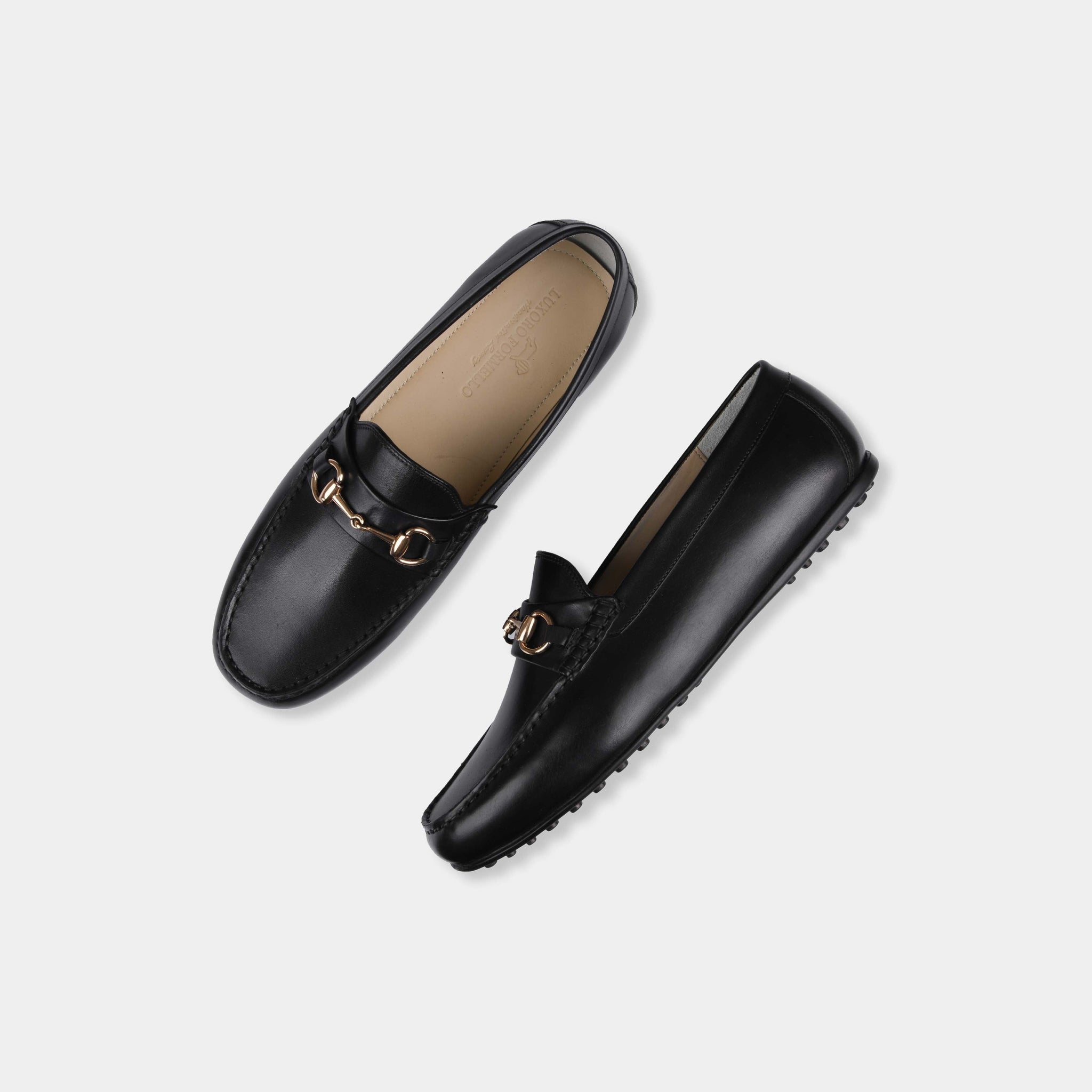 Pair of Marco Black Leather Driving Loafers with gold snaffle bit detail, shown from above.