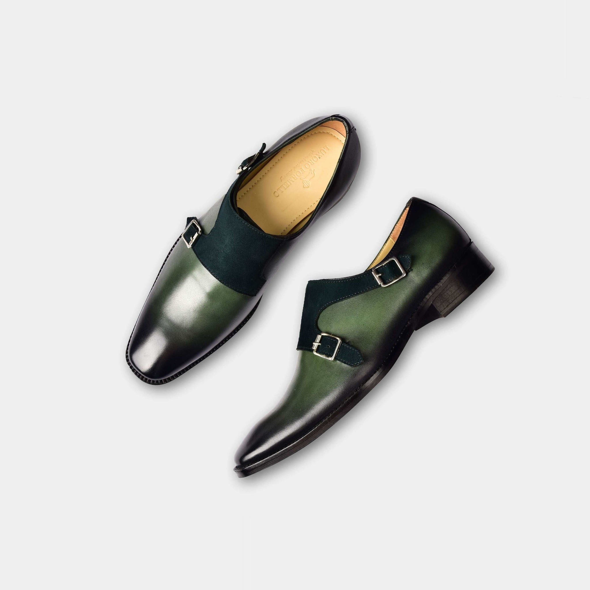 Pair of Chris Parker Leather Monk Straps in green leather with double buckles and black suede accent.