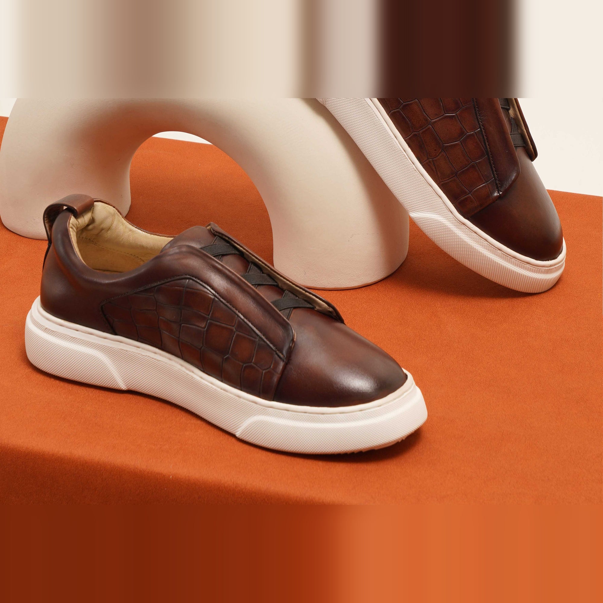 Pair of Eduard Croc Brown Leather Sneakers with white soles, showcasing their stylish crocodile-embossed leather design.