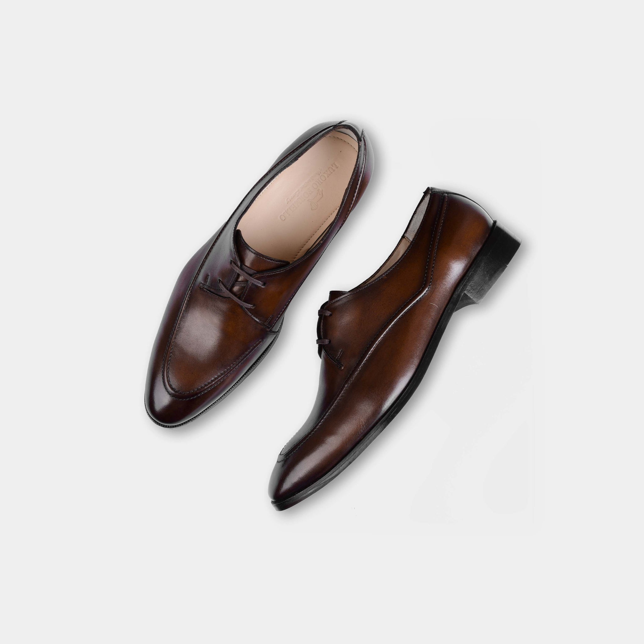 A pair of Marcos Brown Lace Ups, polished brown leather dress shoes, shown from above.