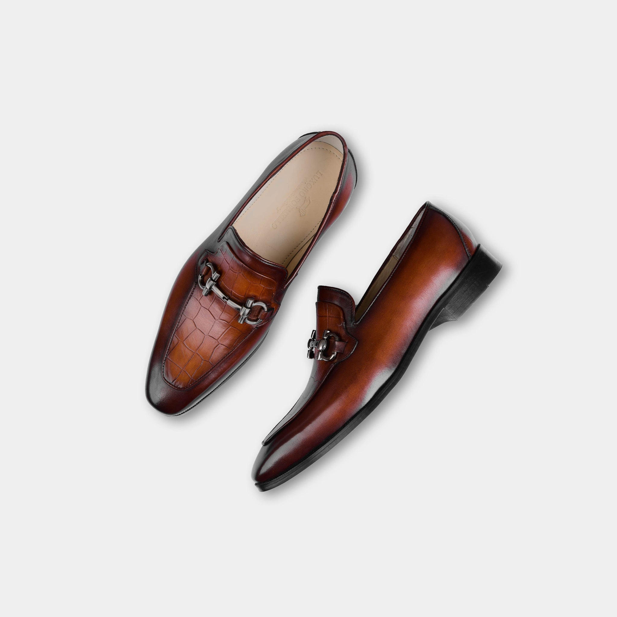 Pair of Gior Cognac Leather Loafers for men with a brushed metal buckle detail.