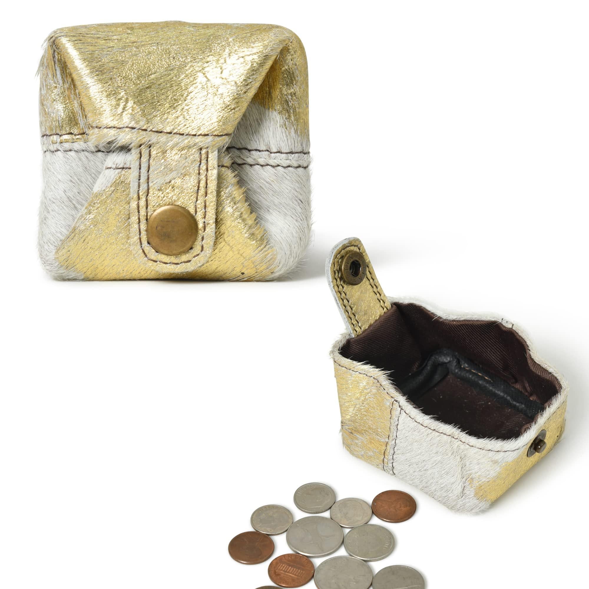 Stylish gold and white leather mini wallet with snap closure, shown open with coins nearby.