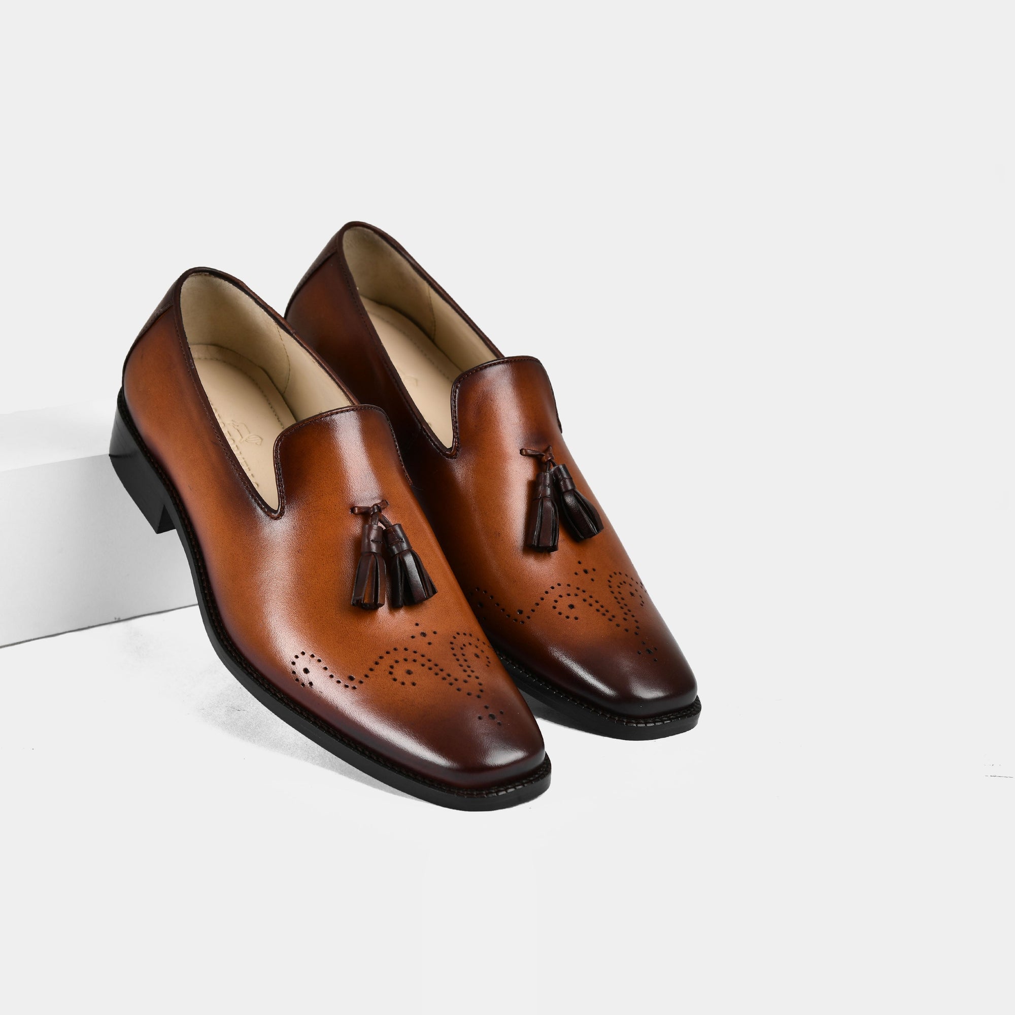 Pair of Vincenz Tan Leather Loafers with tassel detail and brogueing.