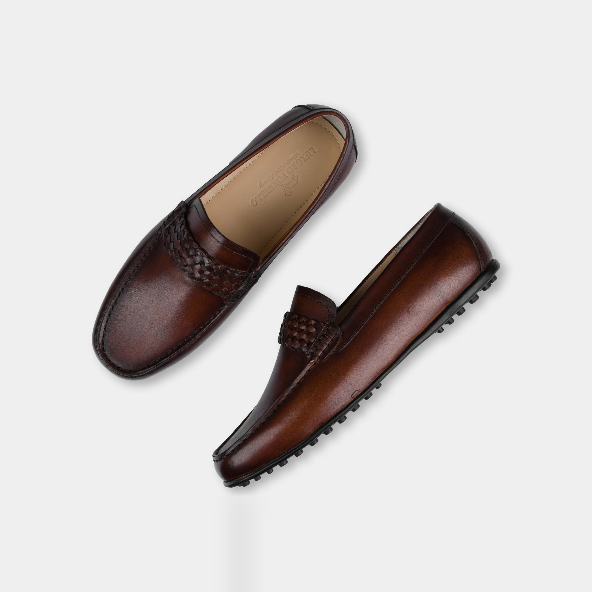 Pair of Denver Brown Leather Driving Loafers in dark brown, featuring a woven leather strap and detailed stitching.