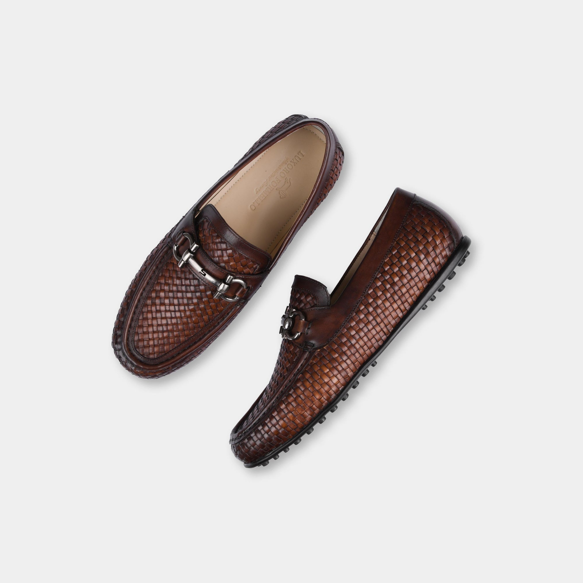 Pair of Lucio Weaved Brown Leather Driving Loafers with a woven leather design and silver buckle detail.