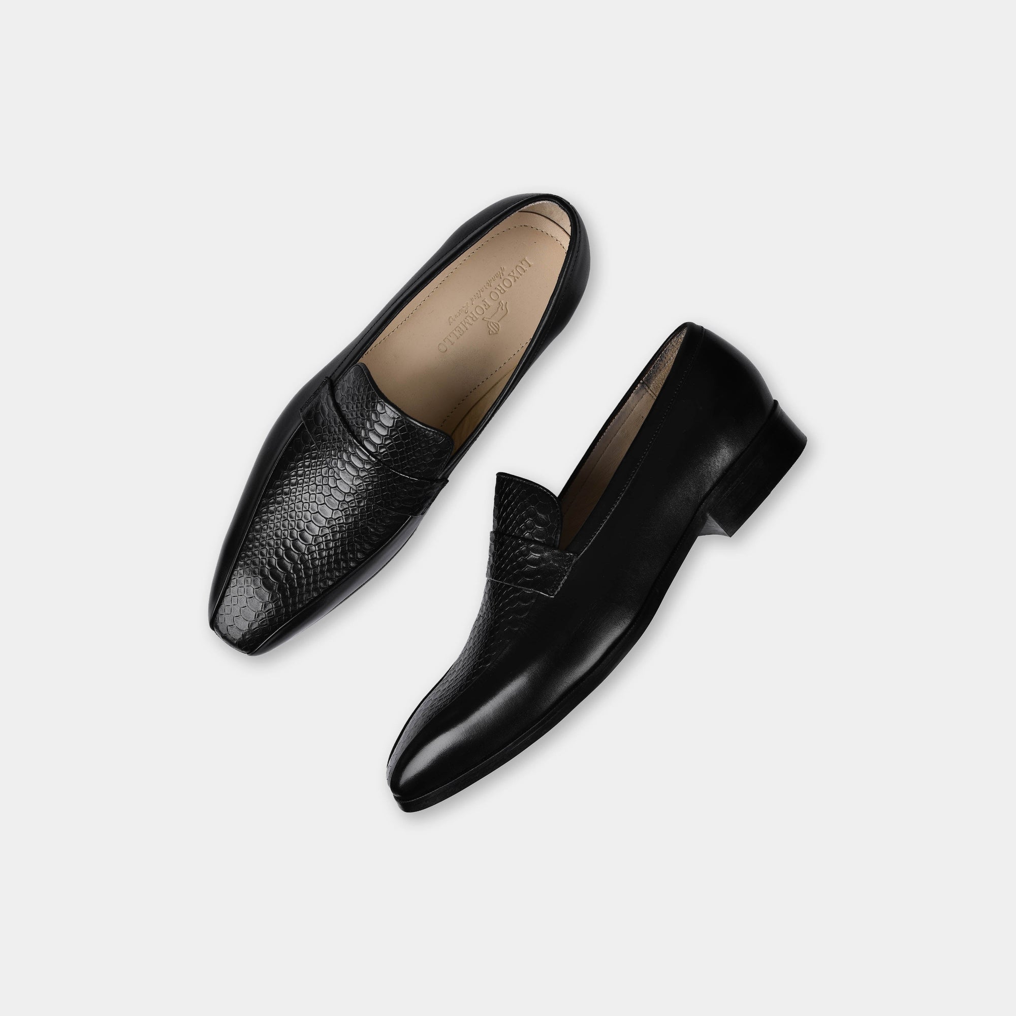 Pair of black leather Jorge penny loafers for men, shown from above on a white background.