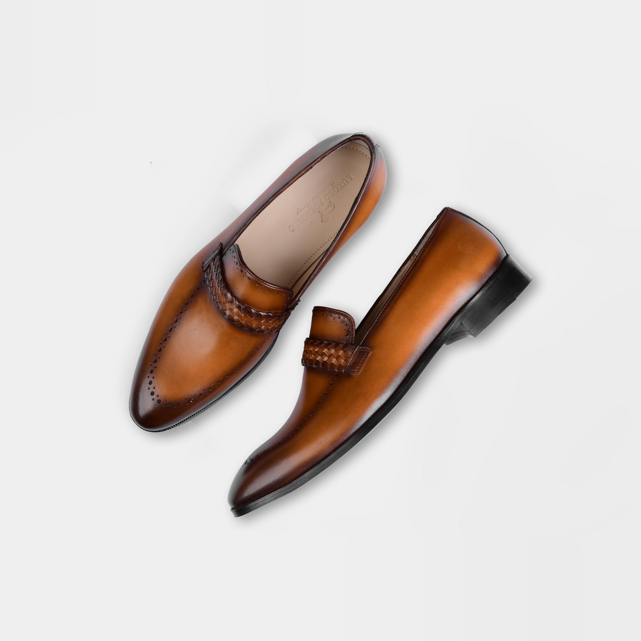 A pair of Alex Tan Leather Loafers in tan brown, featuring a woven leather strap and classic brogue detailing.