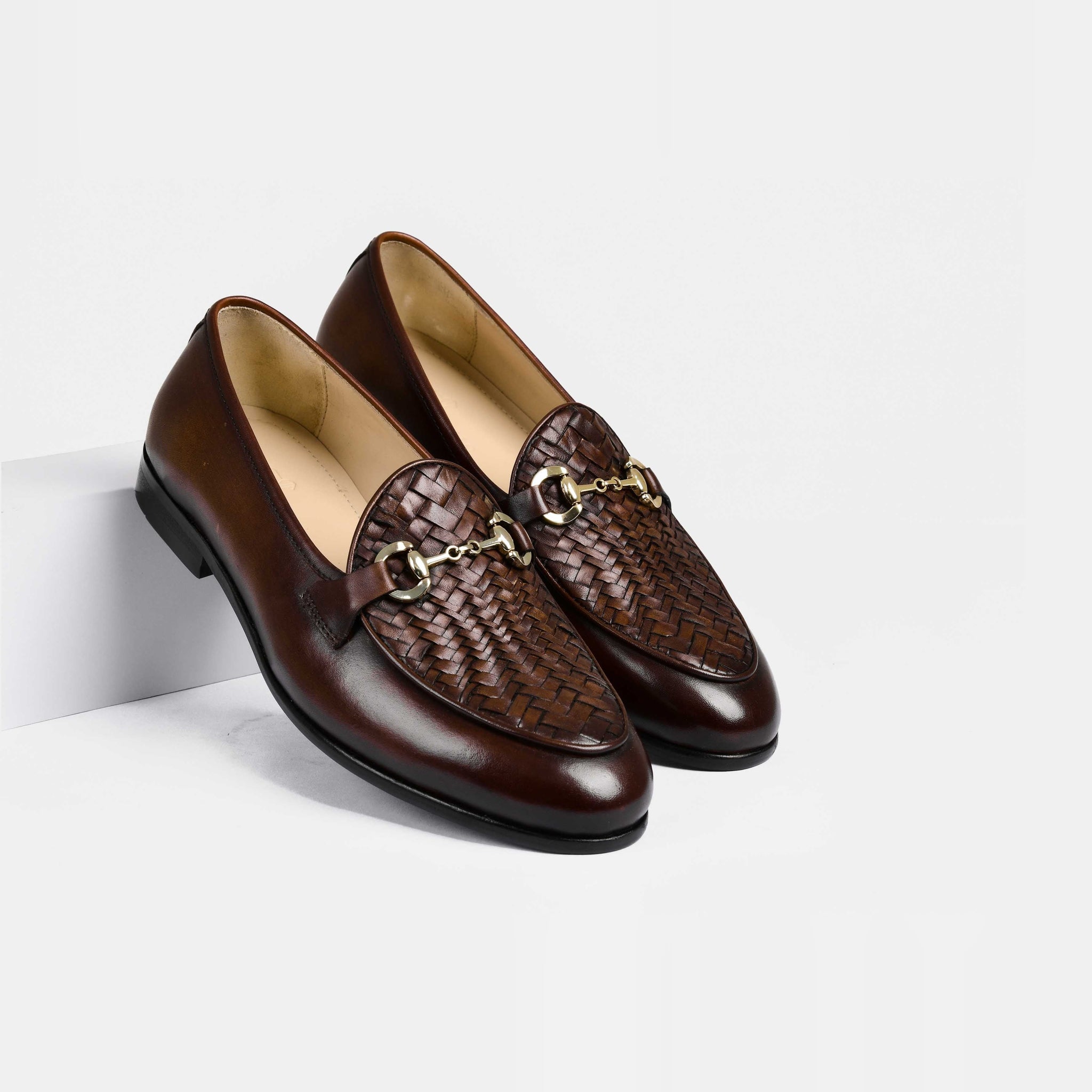 Pair of Santiago Weaved Brown Leather Loafers with woven detailing and a gold buckle accent.