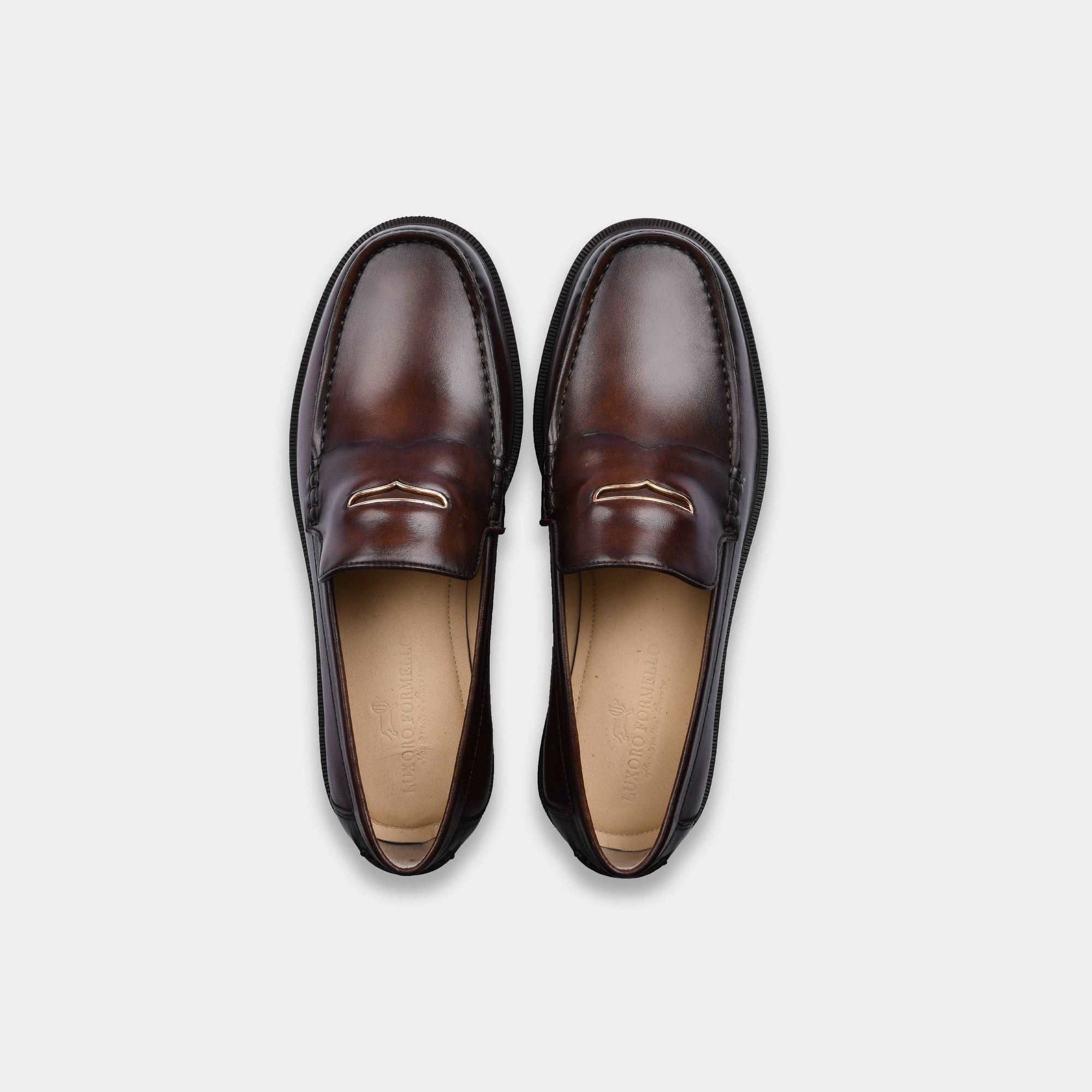 Pair of brown leather loafers, Solesculpt Lite, top view.