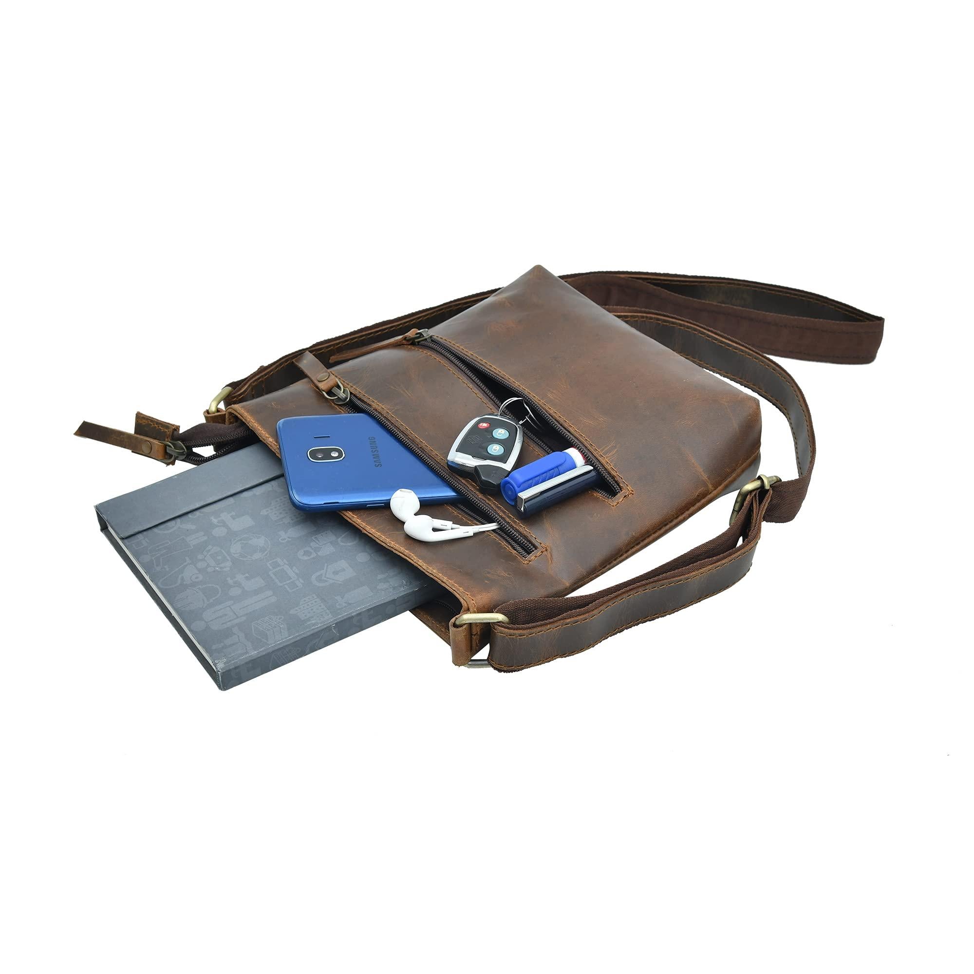 Stylish brown leather crossbody handbag for women, shown open and filled with a phone, keys, and a notebook.