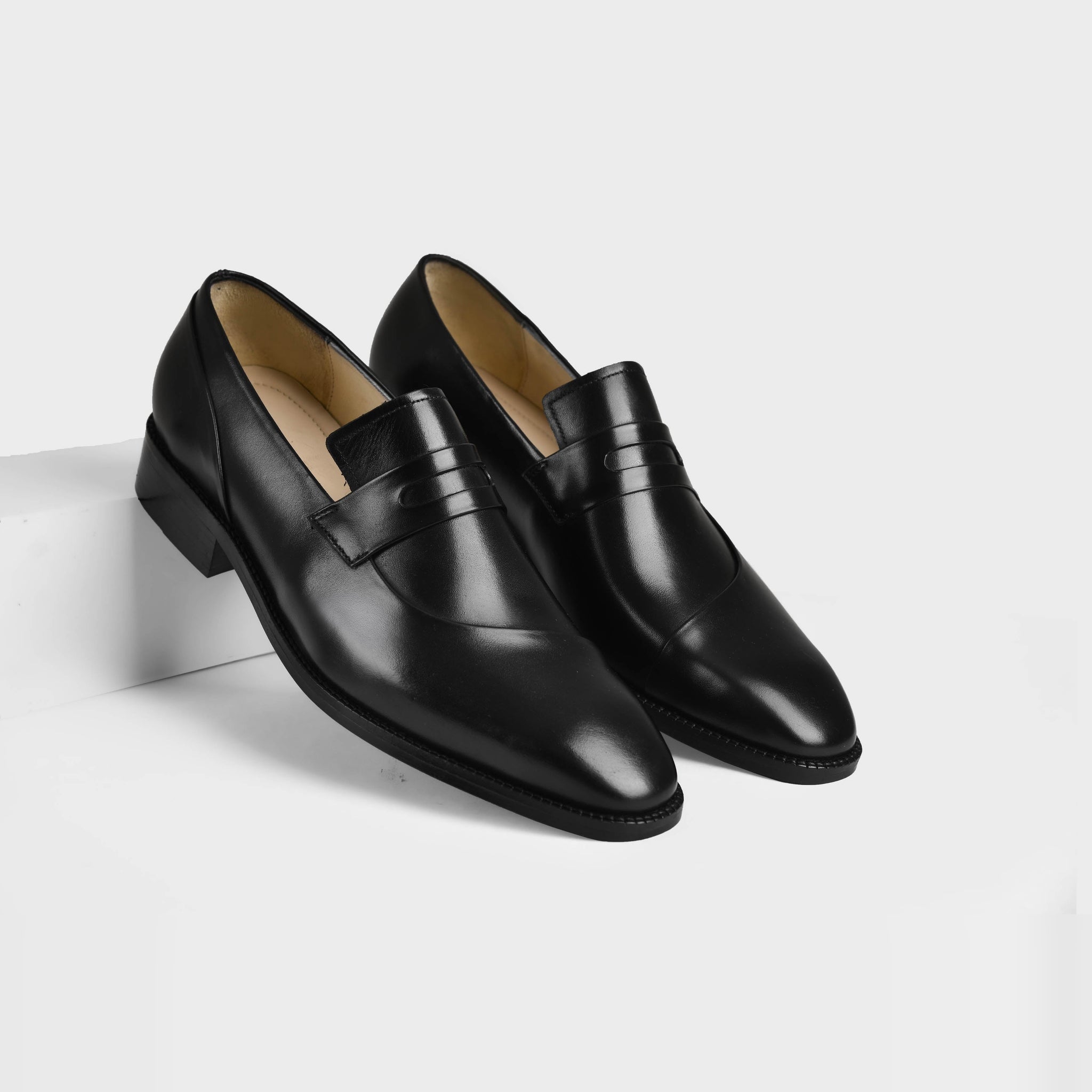 Pair of Laredo Black Leather Loafers with a sleek, polished finish and a classic penny loafer strap.