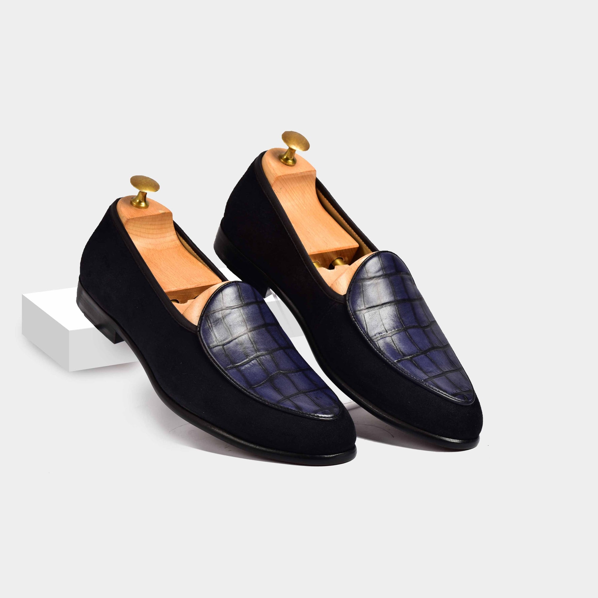 Pair of Arno Loafers in navy blue suede with a textured blue leather overlay.