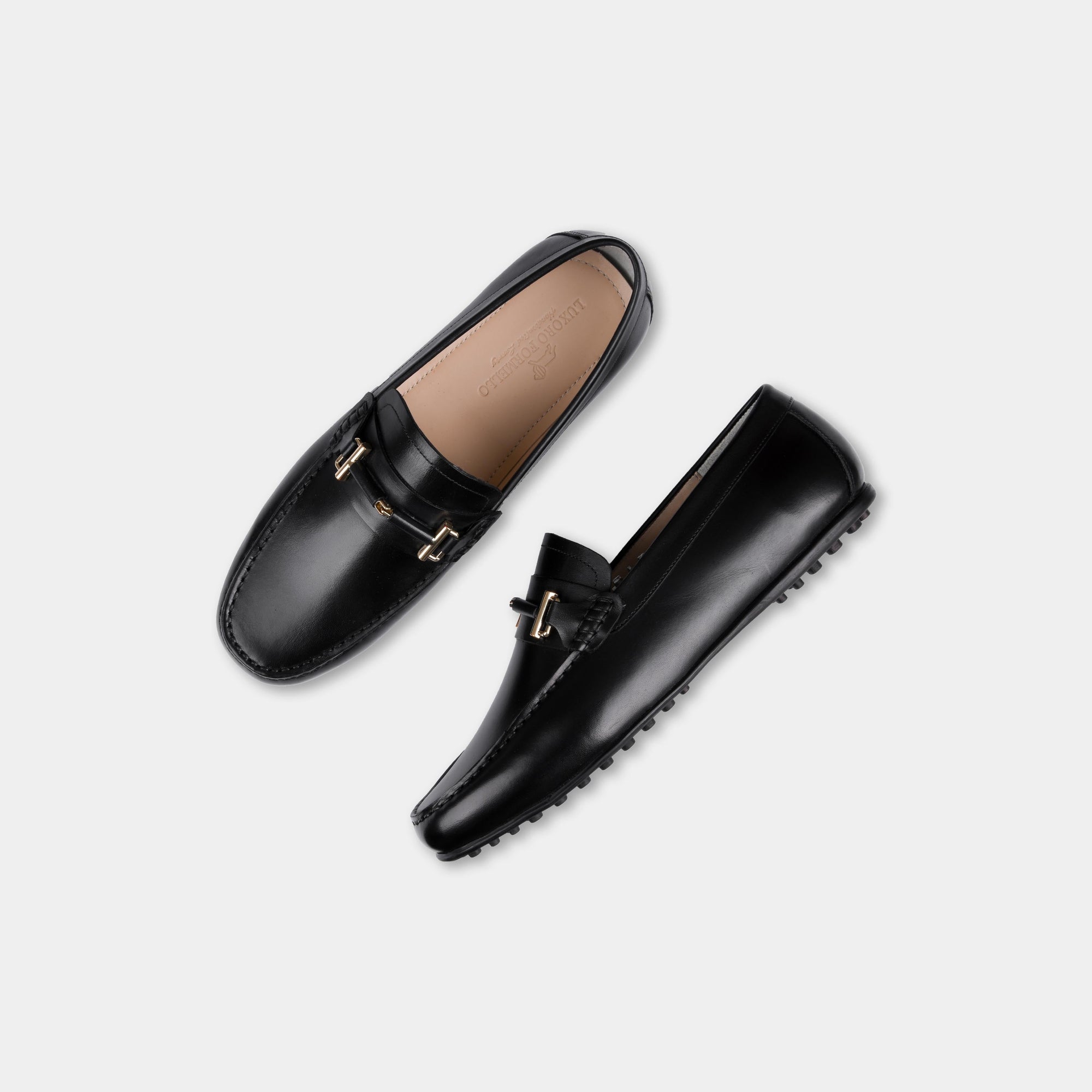 Pair of Diablo Black Driving Loafers with gold buckle detail, shown from above.