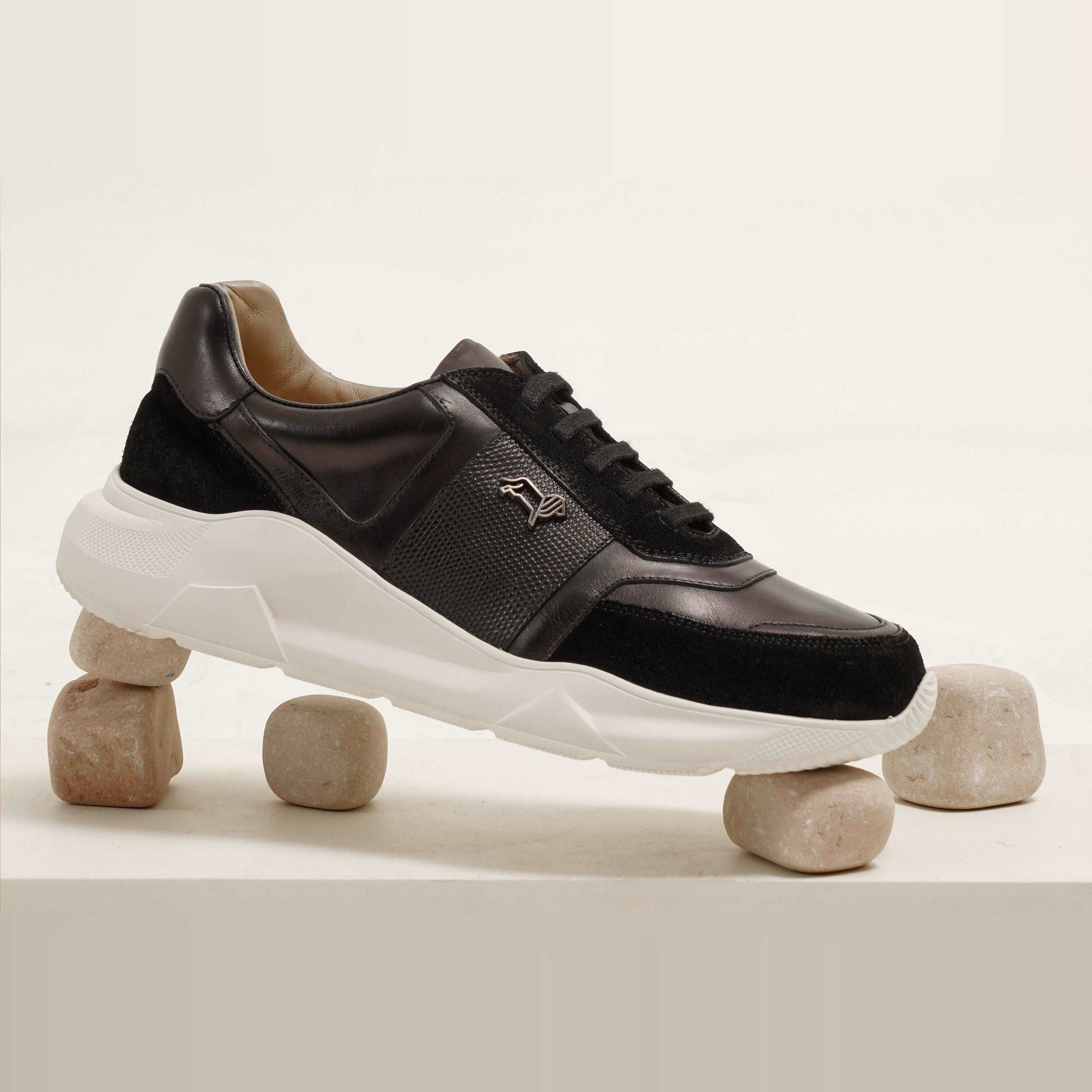 Aureo Black leather sneakers with a white sole. Stylish and modern design for men.