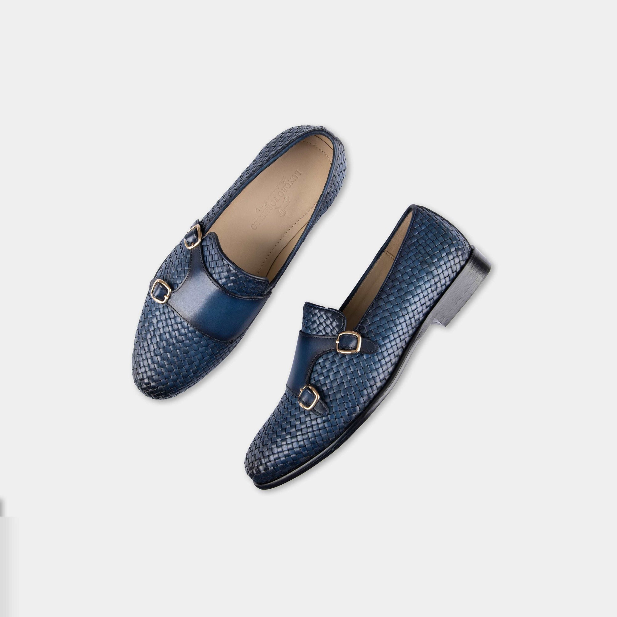 Pair of Ciro Weaved blue leather monk strap shoes with a woven design and gold buckles.