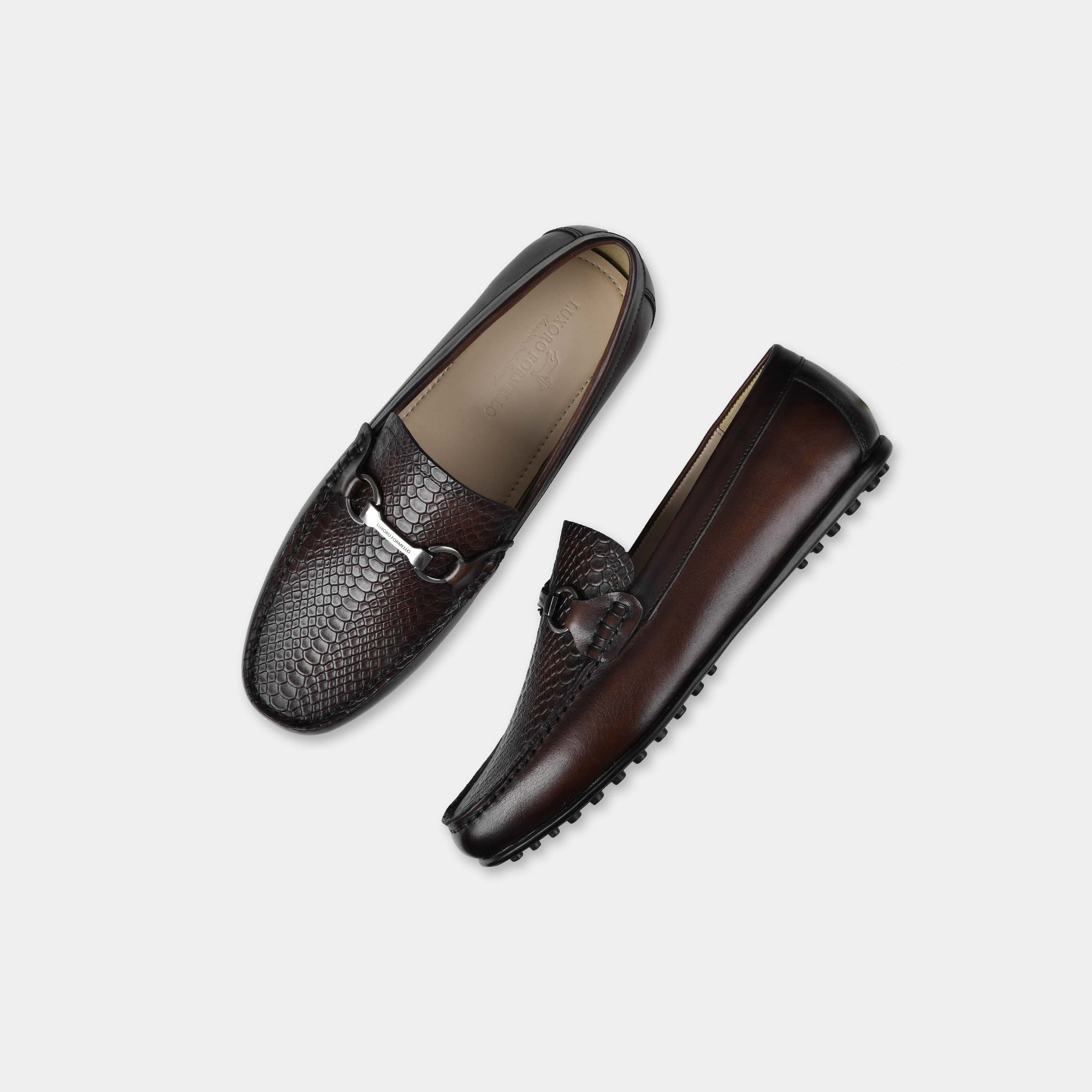 Pair of Matias Brown Leather Driving Loafers with a snakeskin texture and silver buckle detail.