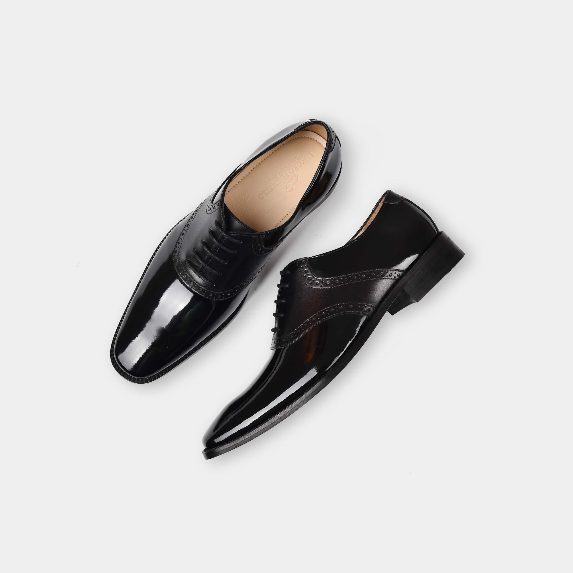 Pair of David Aniston Leather Laceups in black, showcasing their polished finish and classic brogue detailing.