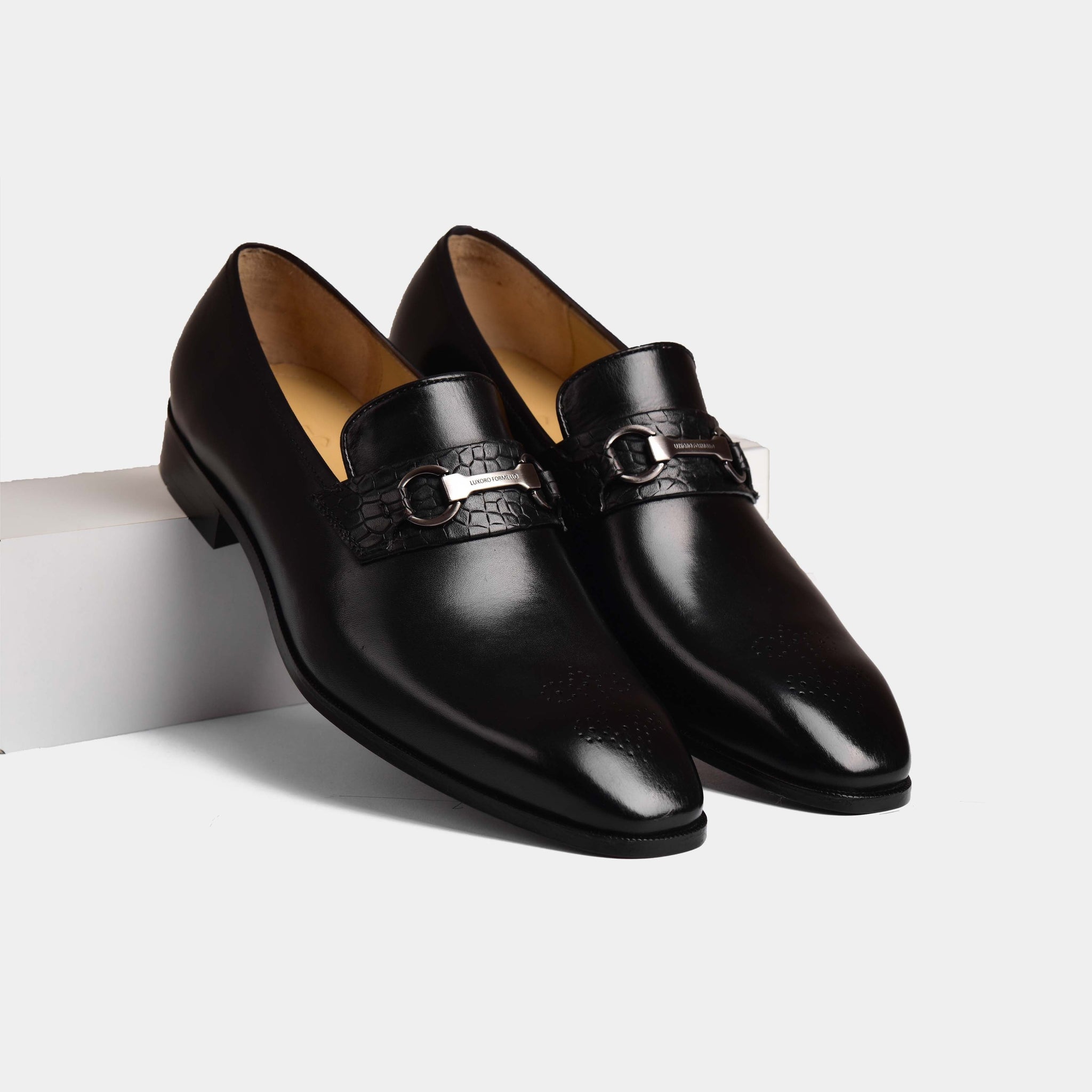 Pair of Diaz Black Loafers, polished black leather with a silver-tone metal accent on the vamp.