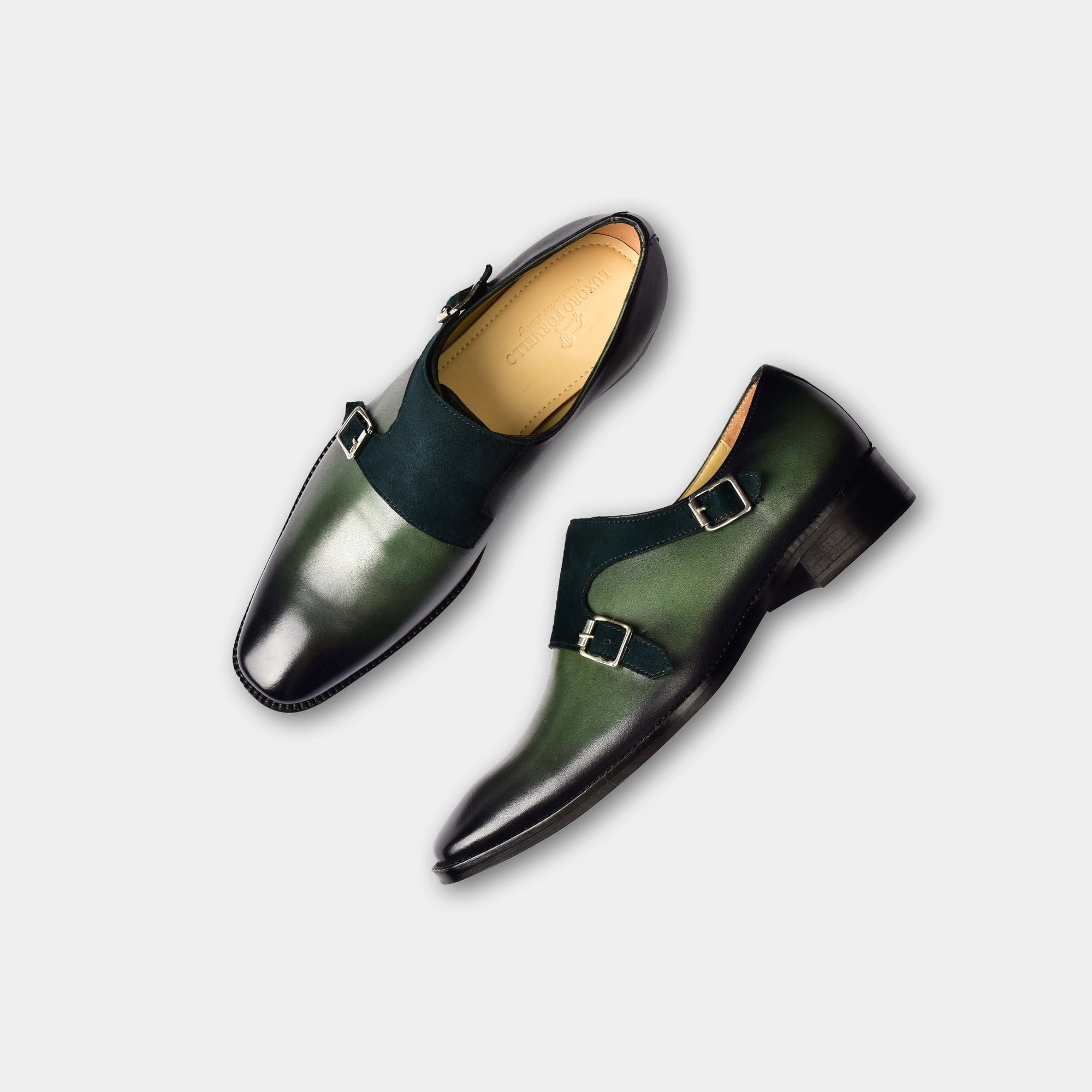 Pair of Chris Parker Leather Monk Straps in green leather with double buckles and black suede accent.