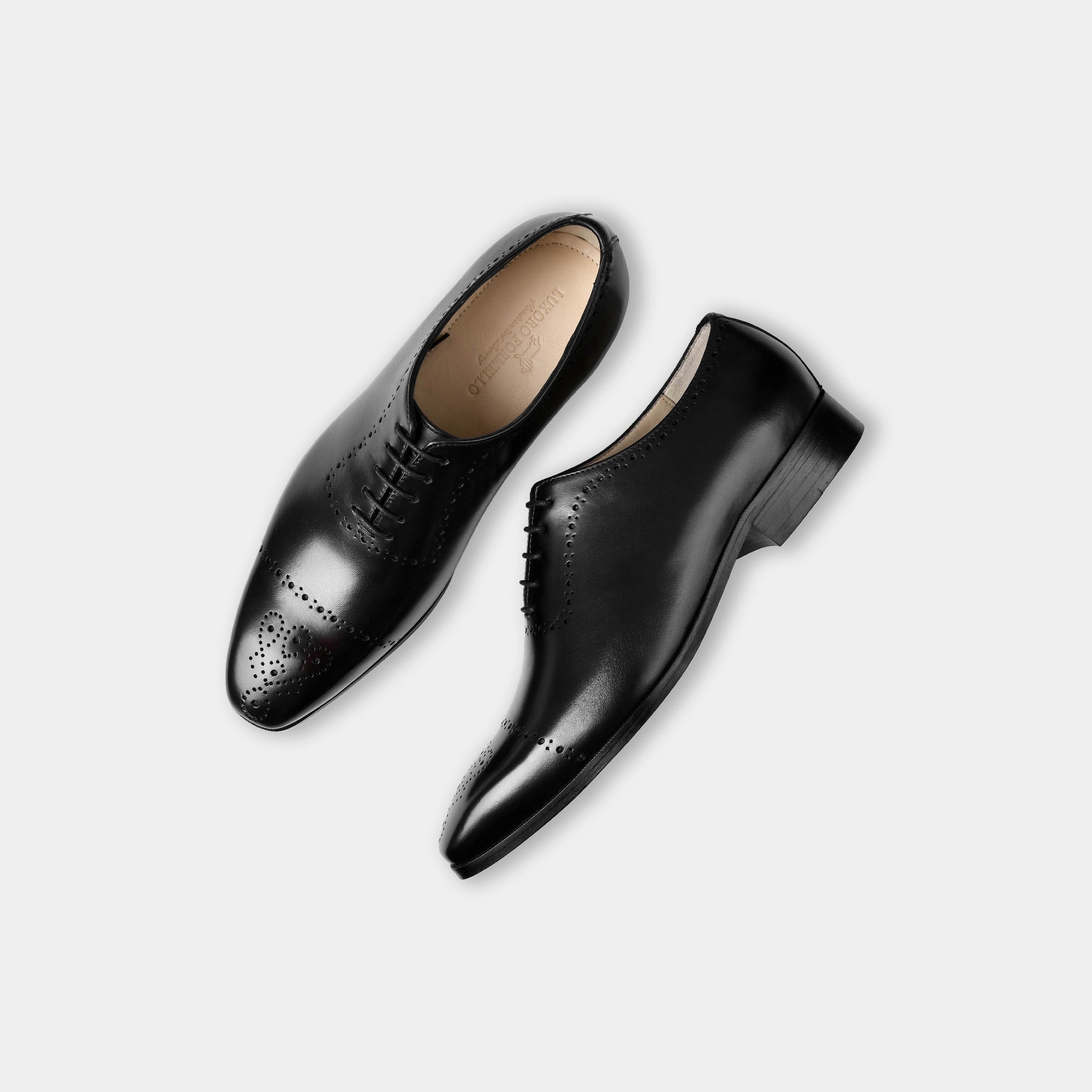 Pair of Lonzo Black Lace Up Oxford shoes with broguing detail, shown from above on a white background.