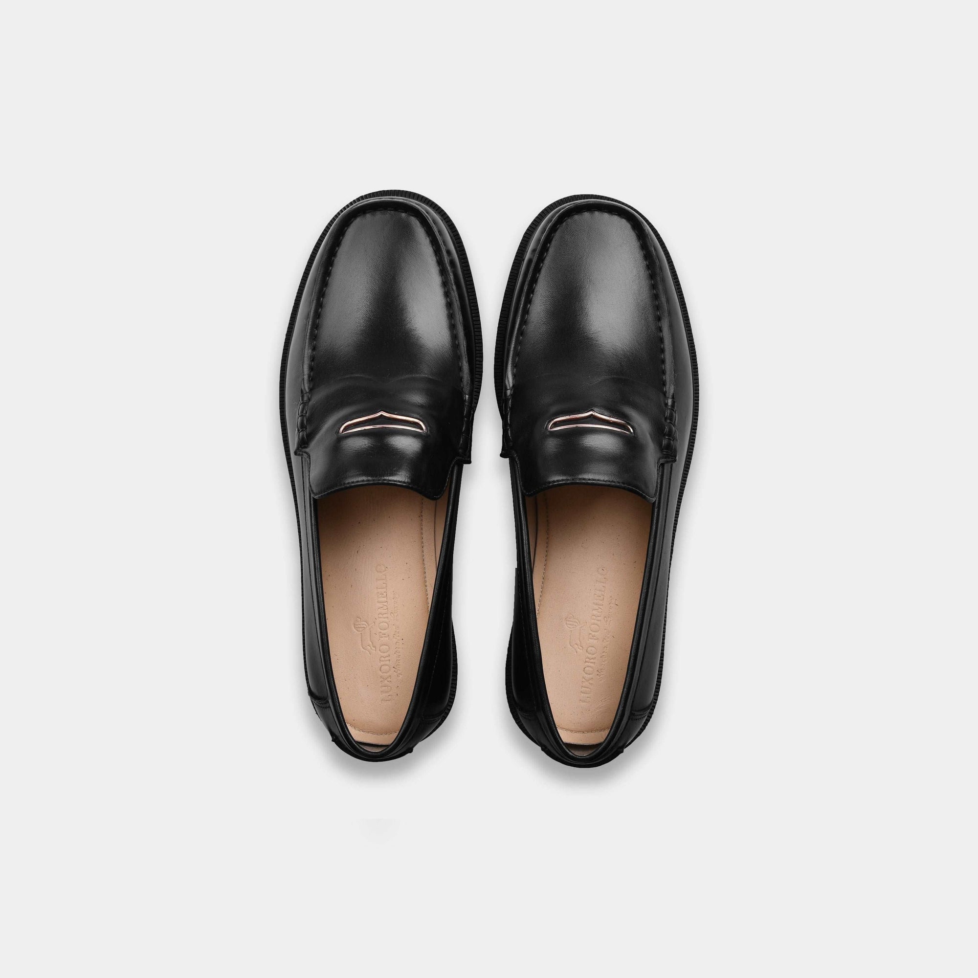 Pair of black leather loafers with Solesculpt Lite technology for a comfortable fit.