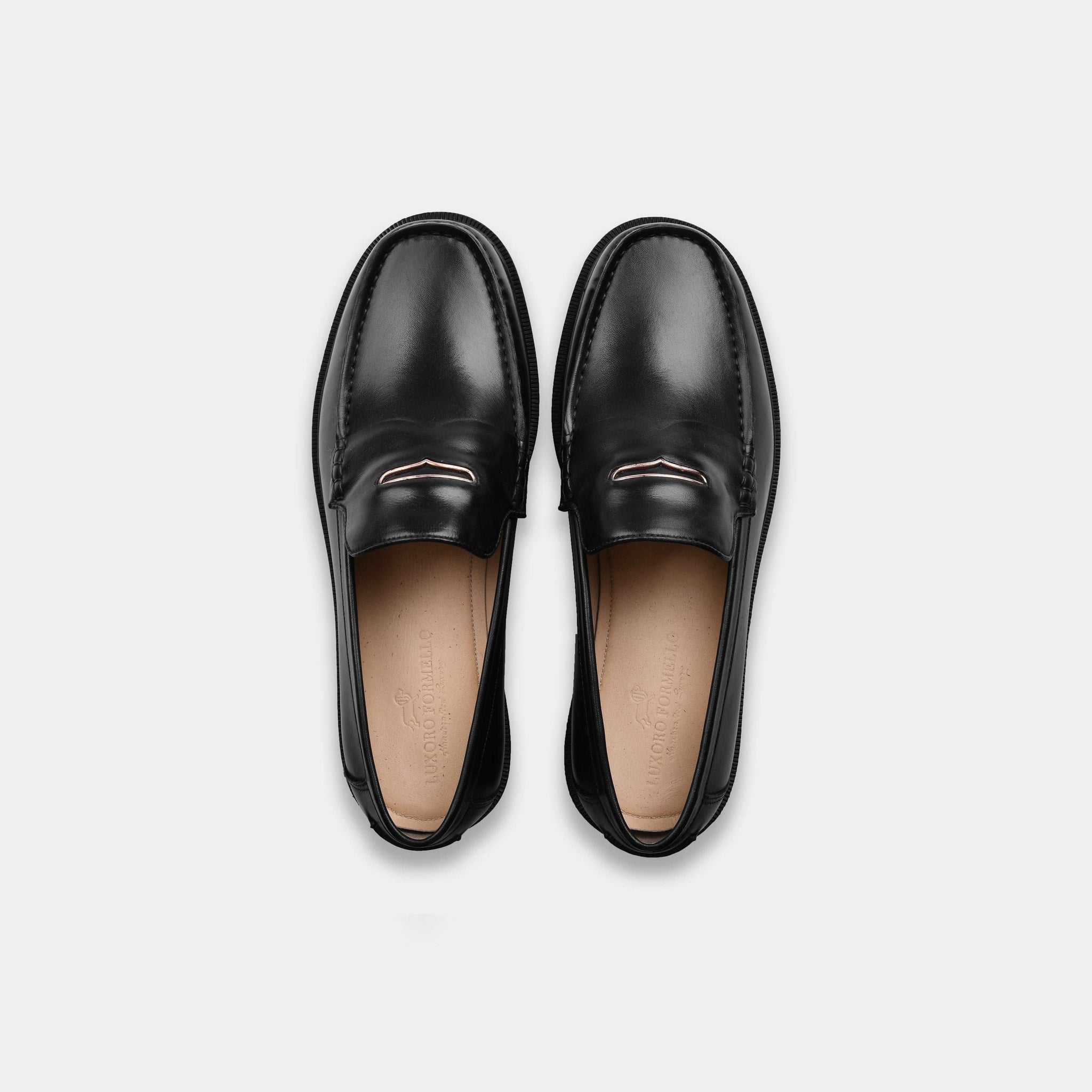 Pair of black leather loafers with Solesculpt Lite technology for a comfortable fit.