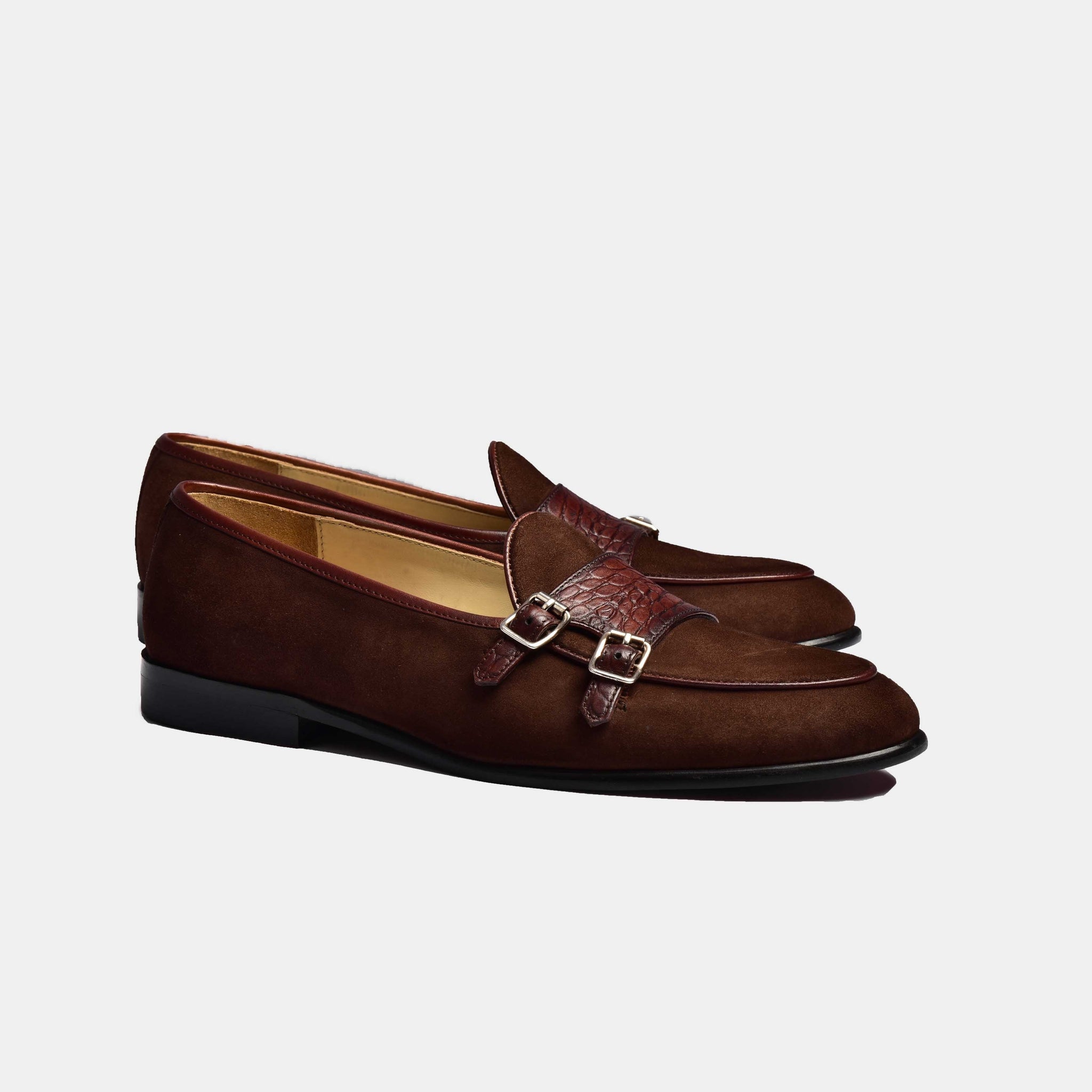 A pair of brown suede Arno Loafers with a double monk strap closure.