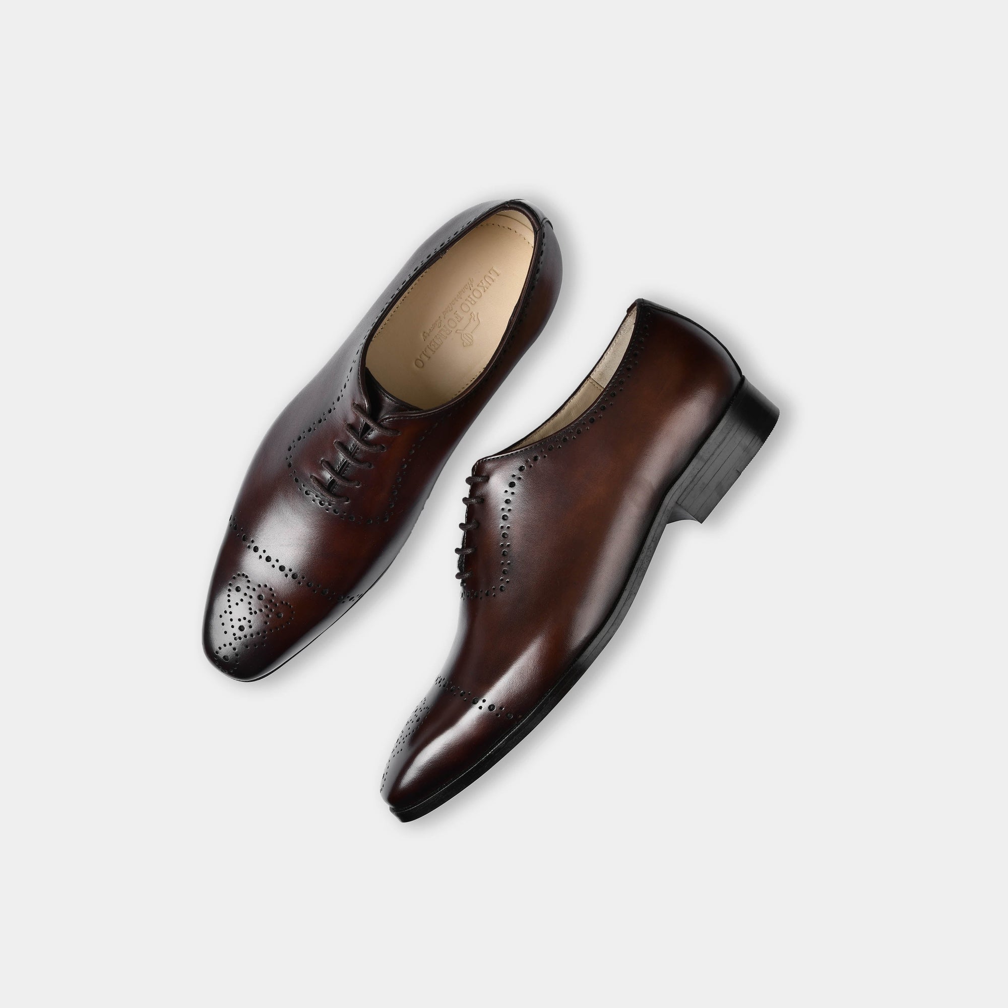 Pair of Lonzo Brown Lace Up brogues, crafted from premium brown leather with decorative perforations.