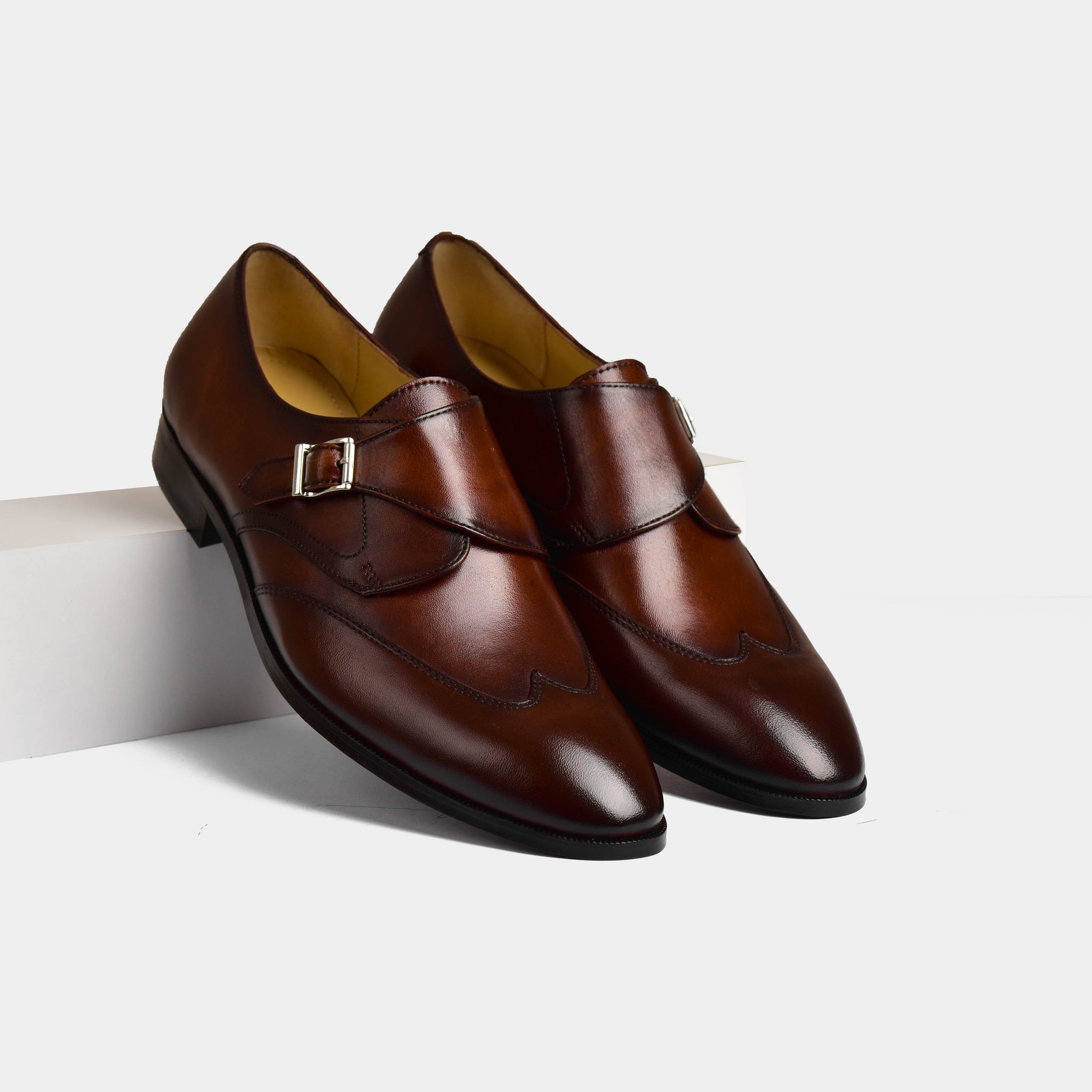 Pair of The Ontario II Leather Monk Straps in brown, showcasing the double monk strap design and classic wingtip detailing.