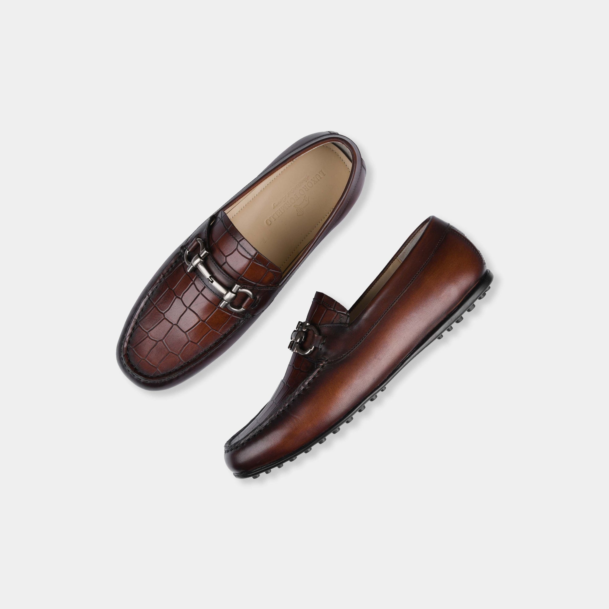 Pair of Alonzo Mid-Brown Leather Driving Loafers with a stylish metal buckle accent on the vamp.