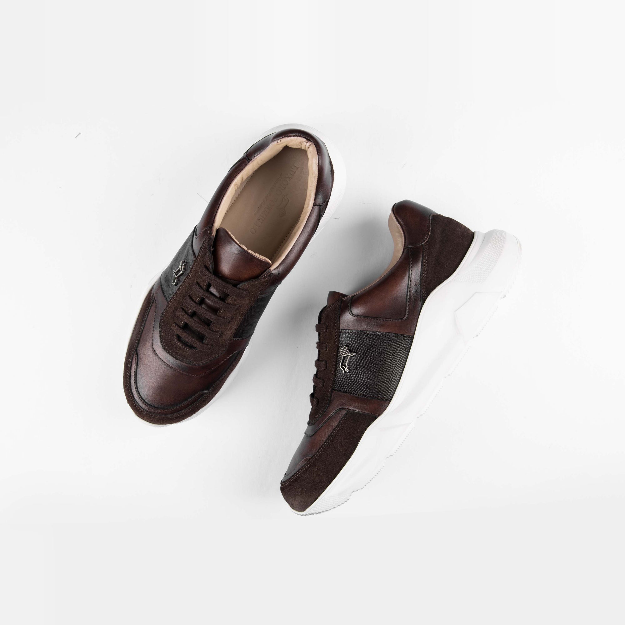 Aureo Brown leather sneakers with white soles, showcasing their stylish design on a clean background.