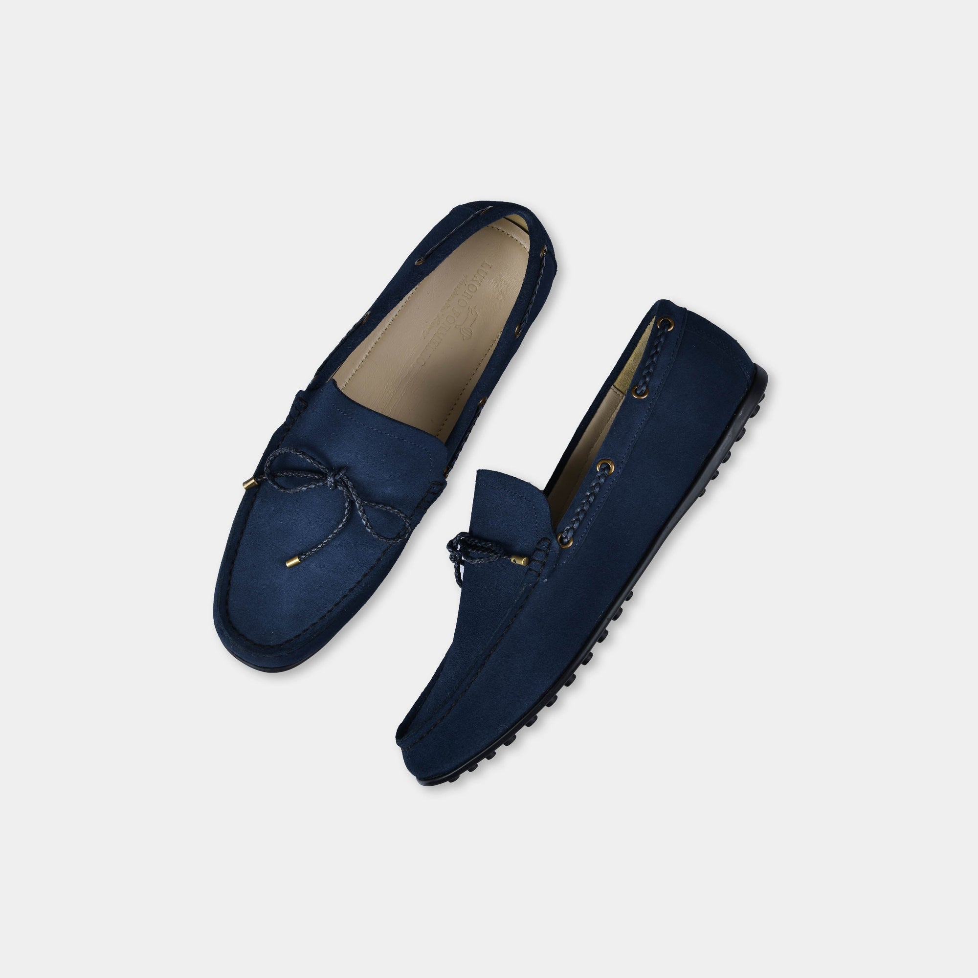 Pair of Julian Blue Suede Leather Driving Loafers on a white background.