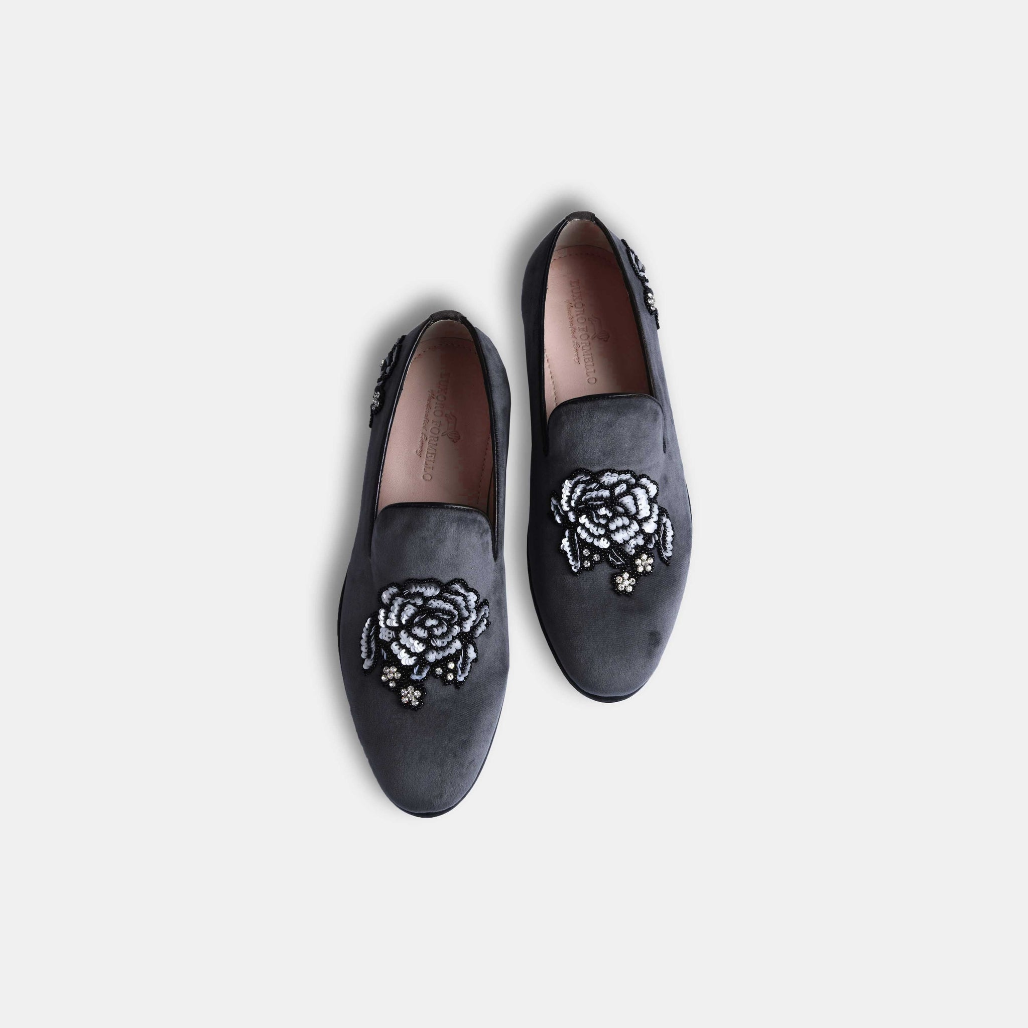 Pair of Cesar Grey Embroidered Leather Slip-Ons with floral embroidery and beading details, set against a white background.