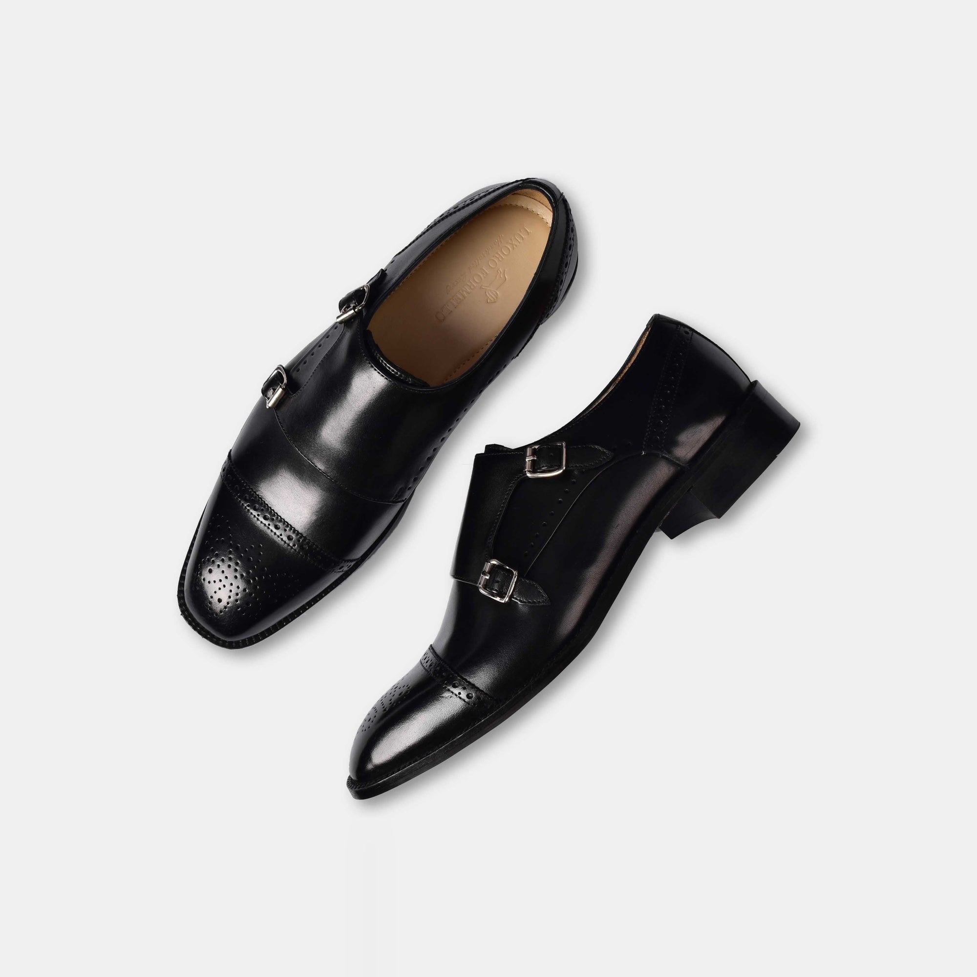 Pair of Aldrich Black Monk Leather Monk Straps shoes.