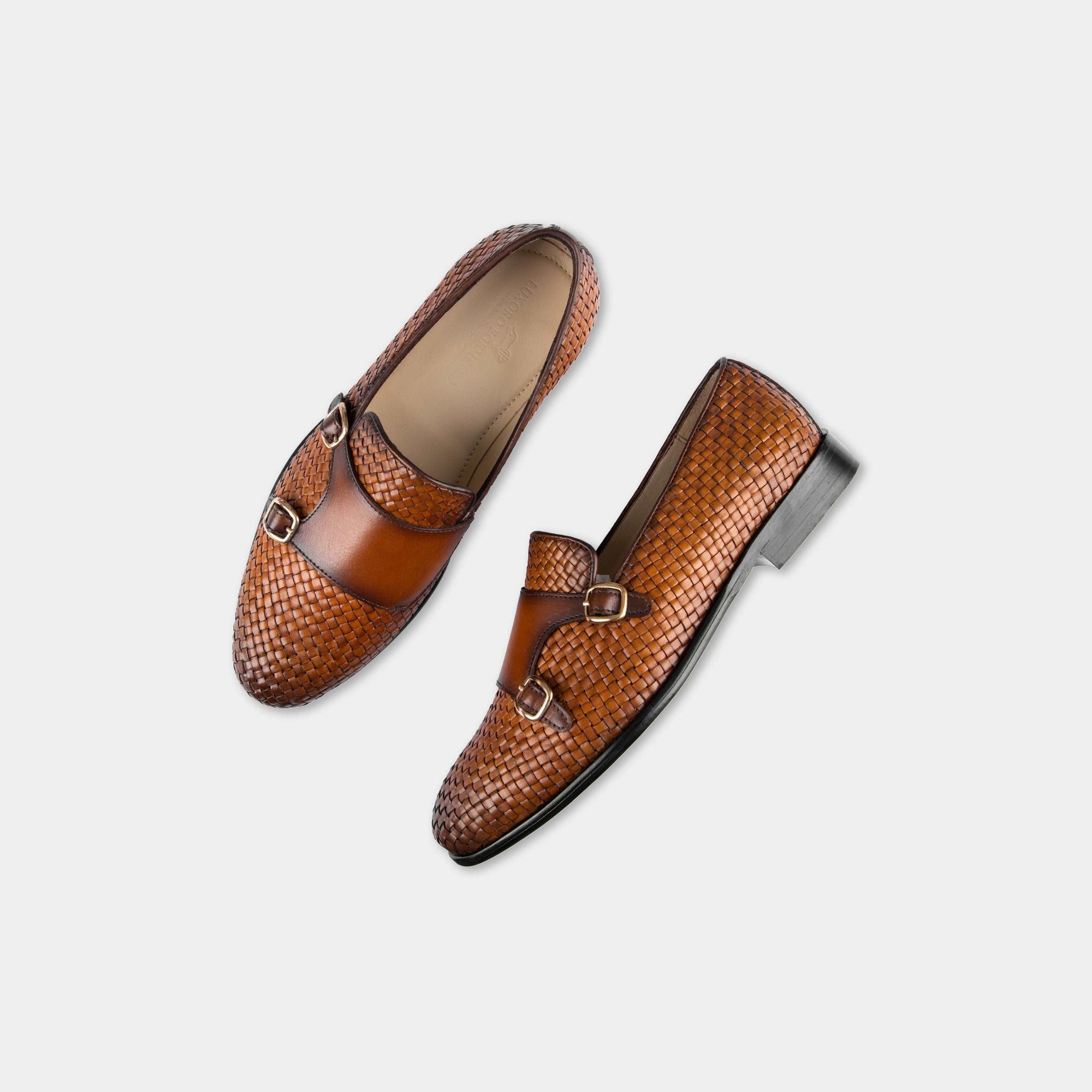 Pair of Ciro Weaved Tan Leather Monk Strap shoes, showcasing their woven leather upper and double buckle closure.