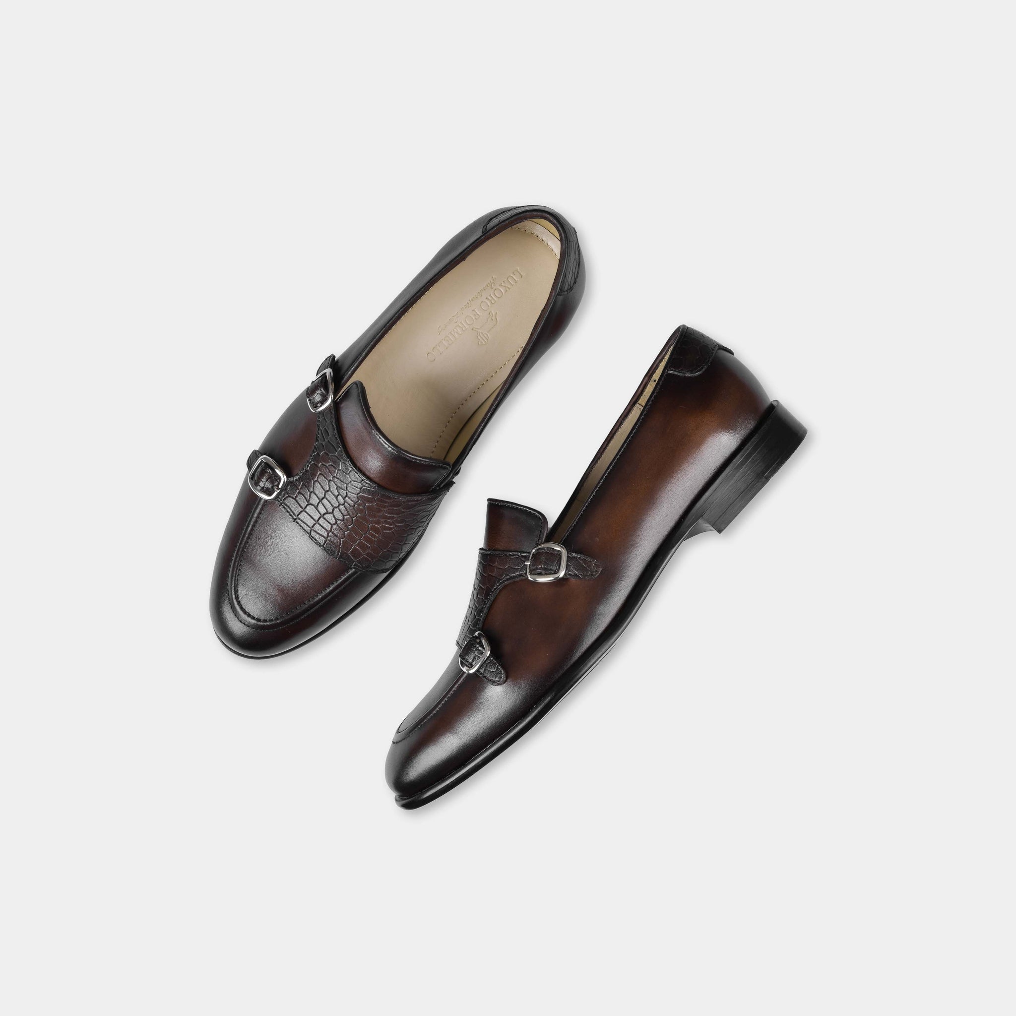 Pair of Armeo Brown Leather Monk Straps shoes with double buckles and a crocodile-embossed strap detail.