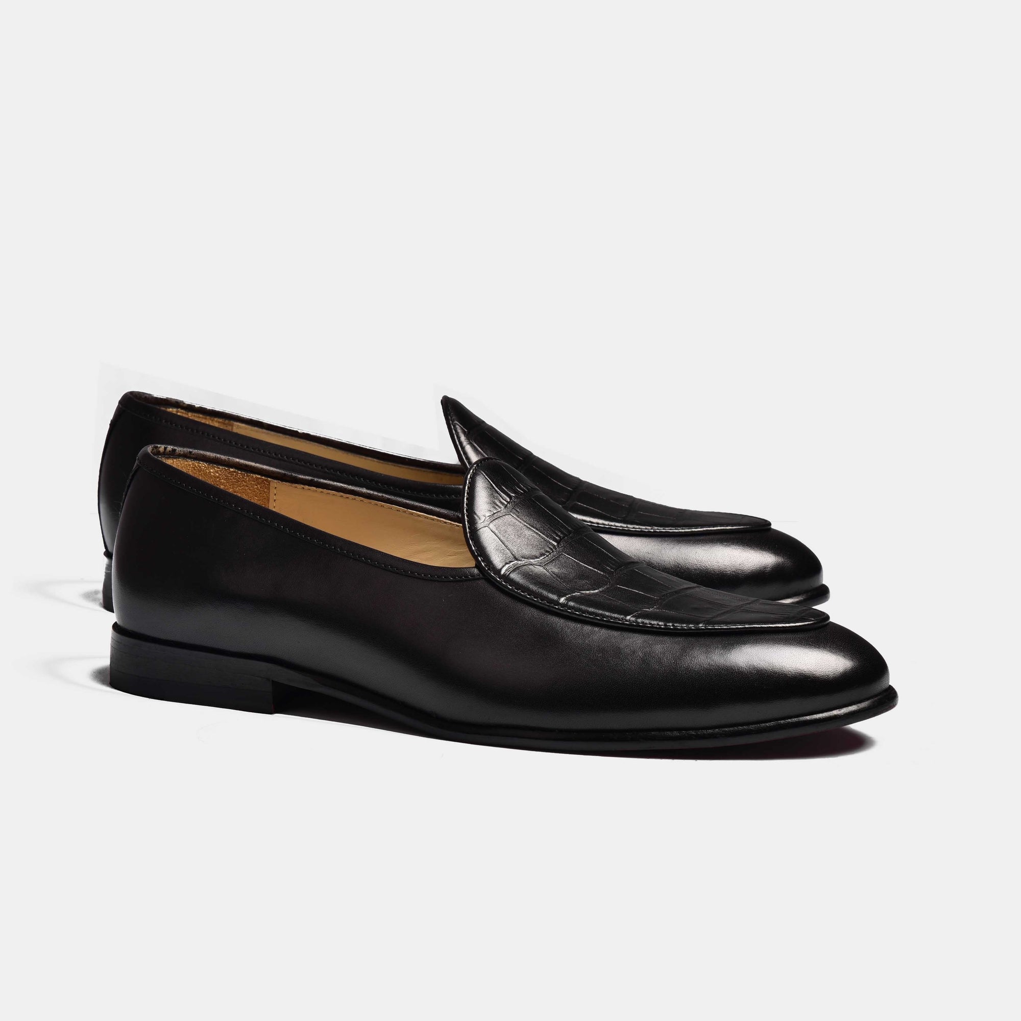 Pair of black Arno Loafers with a textured vamp detail, made from precious leather.