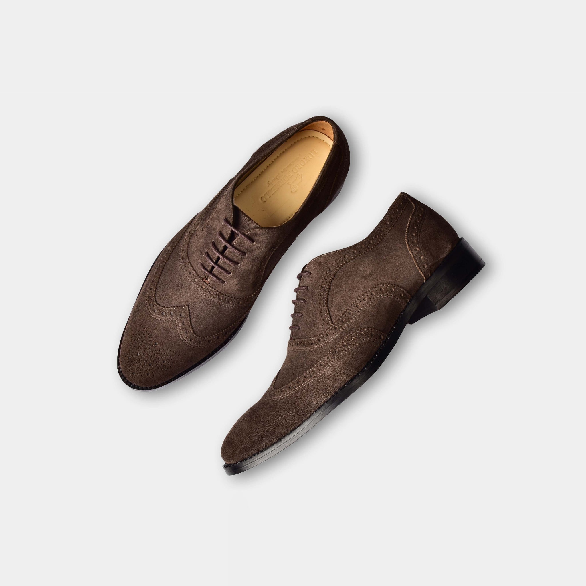 Pair of Jose Suede Brown Leather Laceups, a stylish men's dress shoe with brogue detailing.