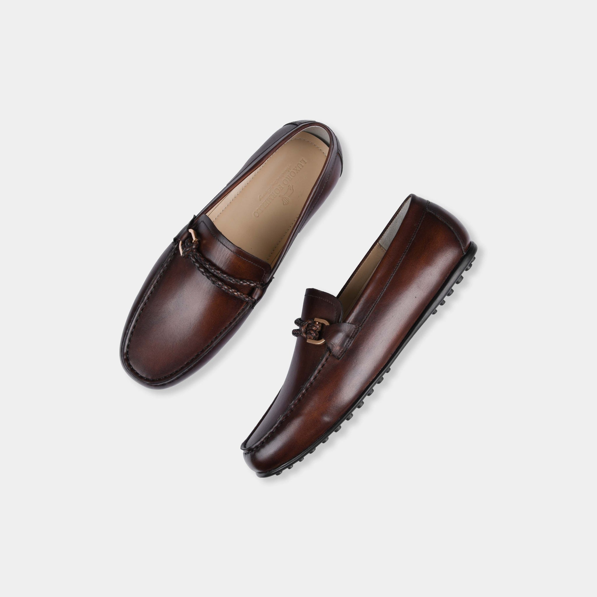 Pair of Pablo Brown Leather Driving Loafers with braided strap and metal accent.