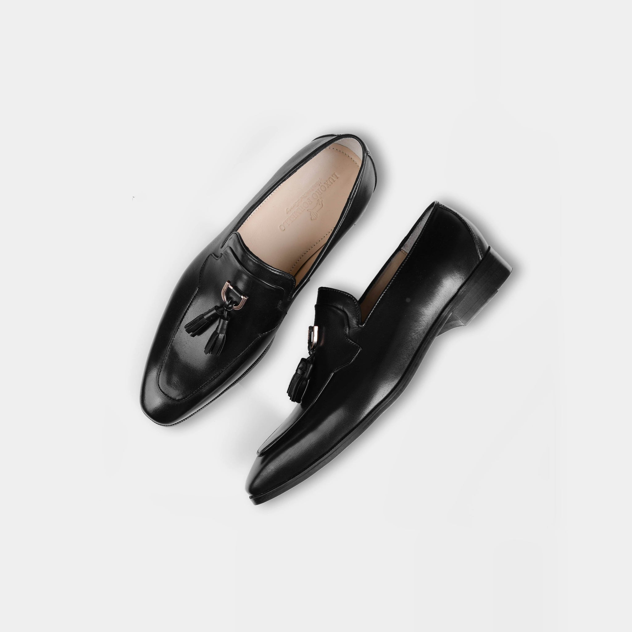 Pair of Atilio Black Leather Loafers with tassels, showcasing their sleek and polished design.