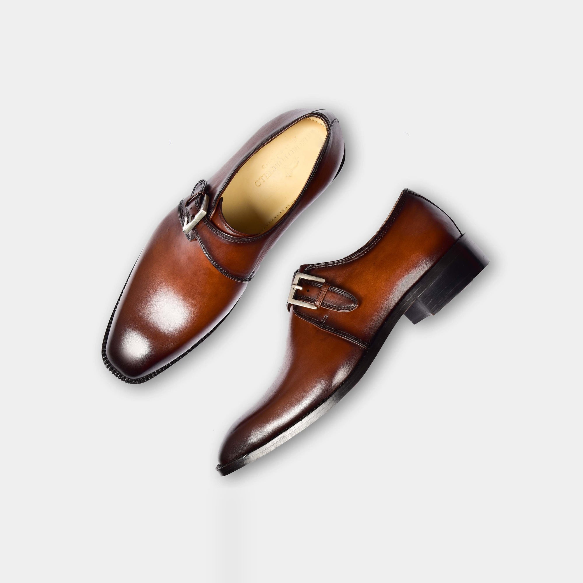 Pair of Ross Single Leather Monk Straps in brown, showcasing the sleek design and single buckle closure.