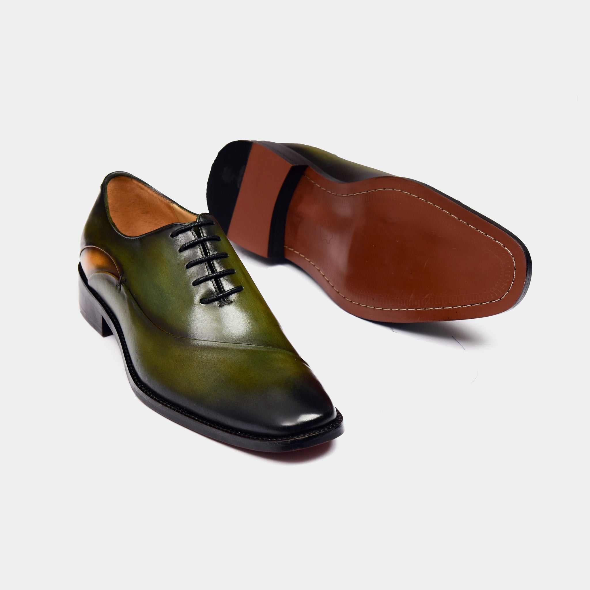 Pair of Jacob Green Laceup Leather Laceups, showcasing their rich green patina and classic lace-up design.