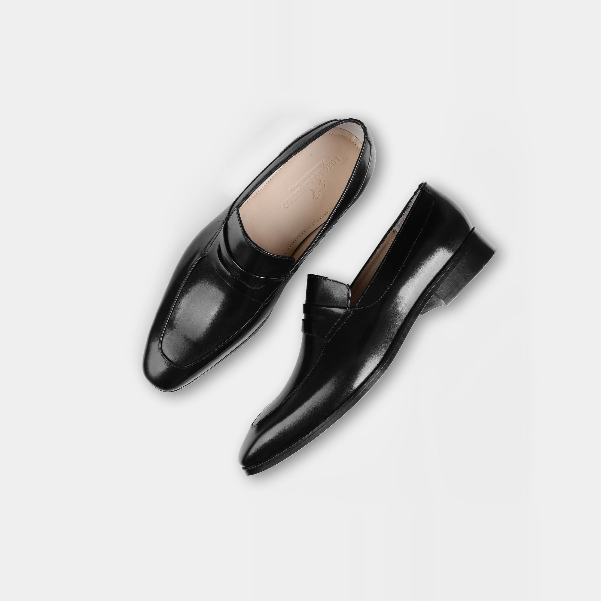 Pair of Andres Black Loafers with a sleek, polished finish, perfect for formal occasions.